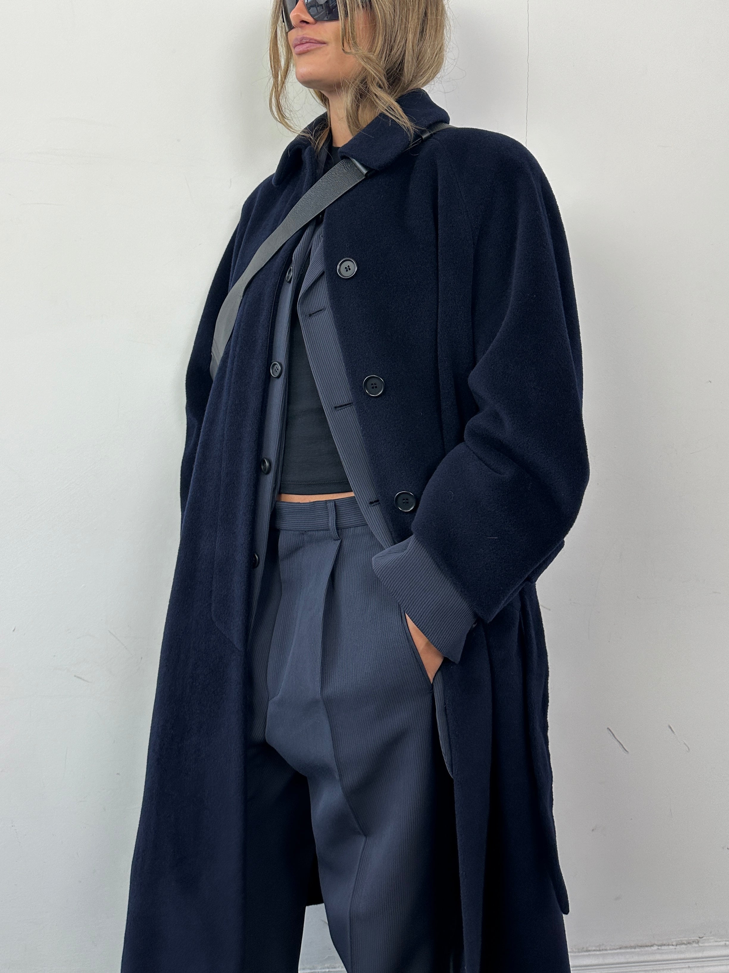 Vintage wool belted coat with concealed placket, single-breasted design in size L, showcasing classic style and textured fabric.