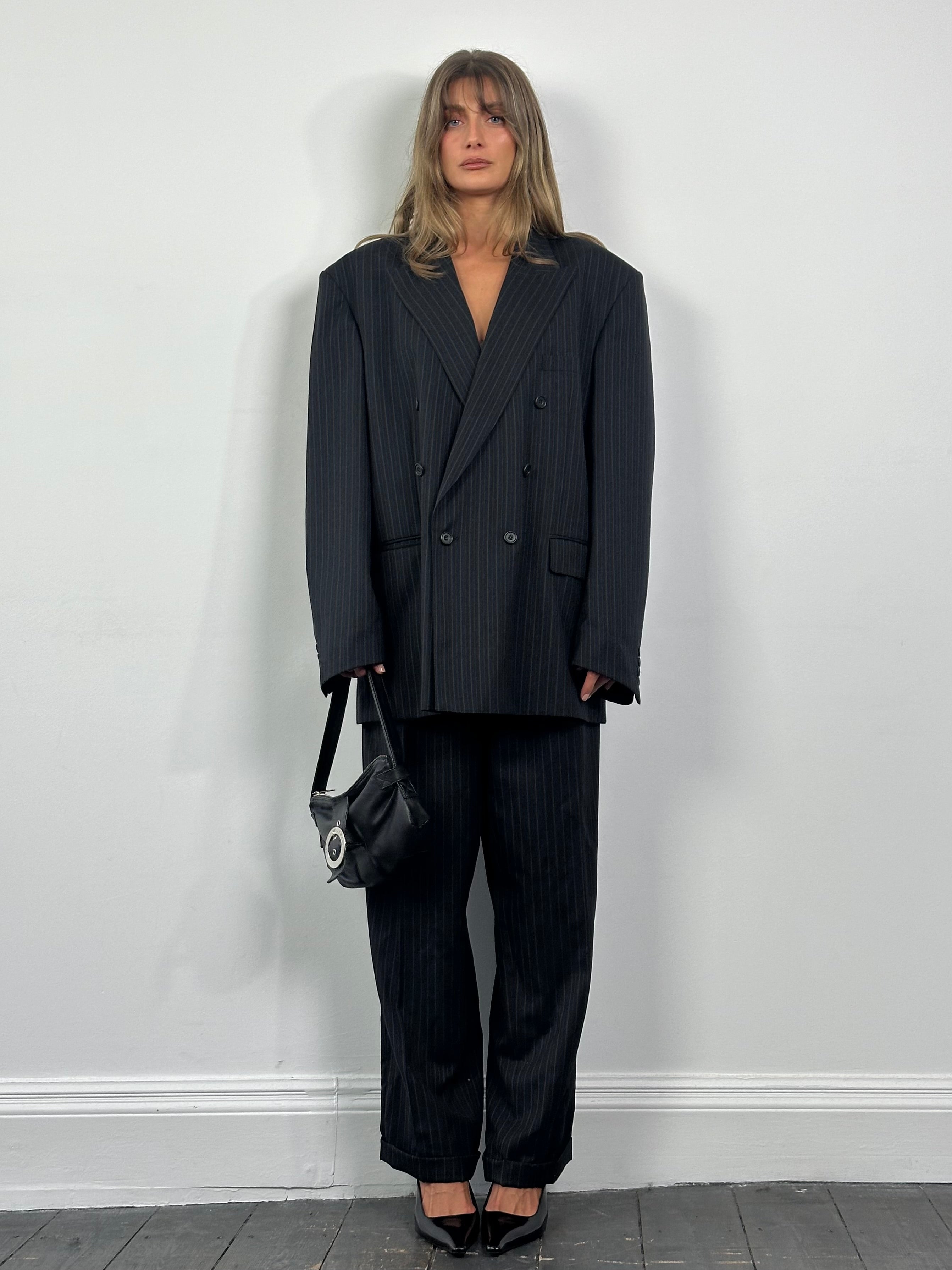 Christian Dior Monsieur 1990s pure wool pinstripe double-breasted suit in size 46L/W32, shown on a hanger with detailed fabric texture.