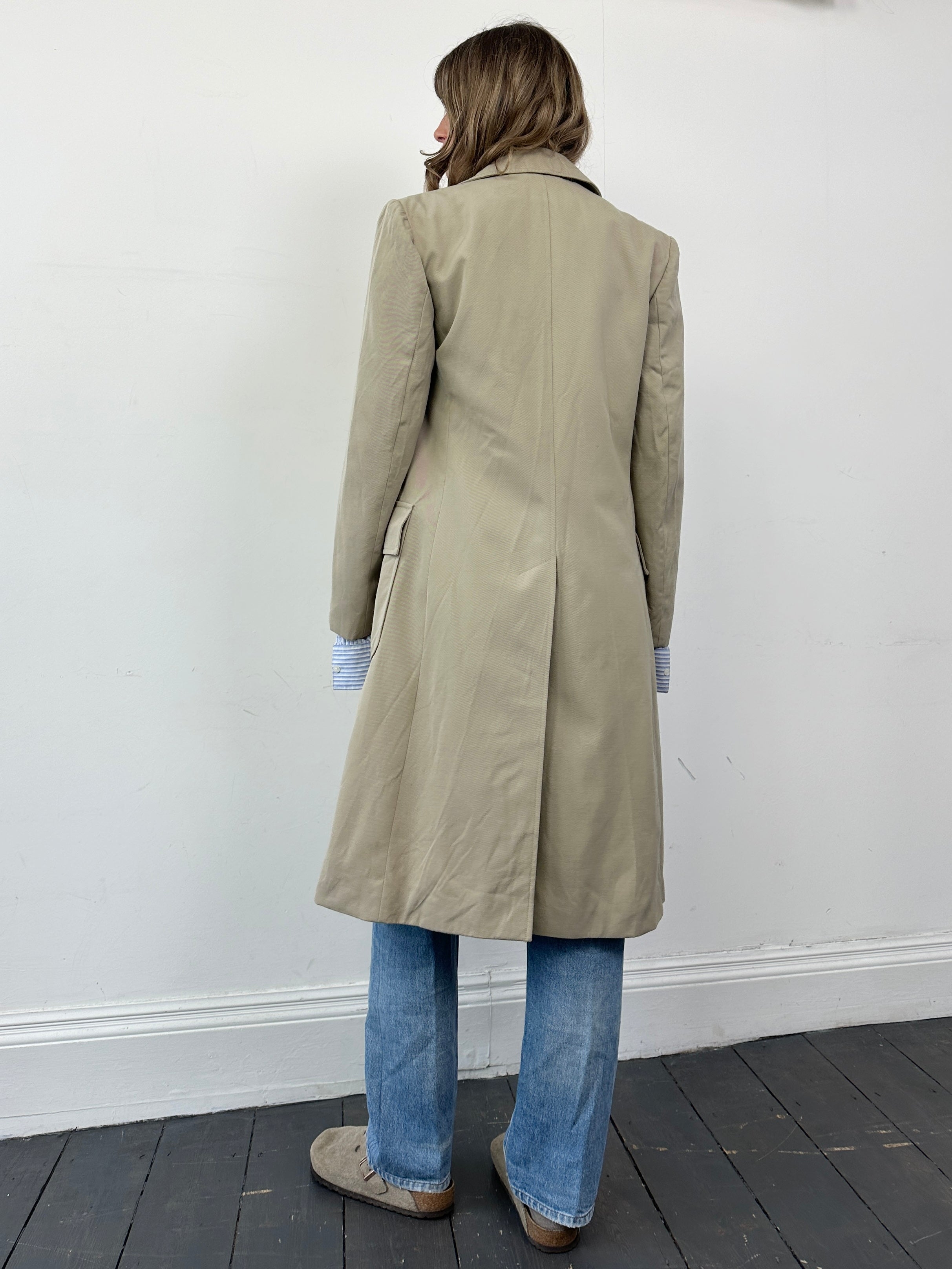 Vintage Italian double-breasted wool trench coat in classic style, featuring a tailored fit and traditional design.