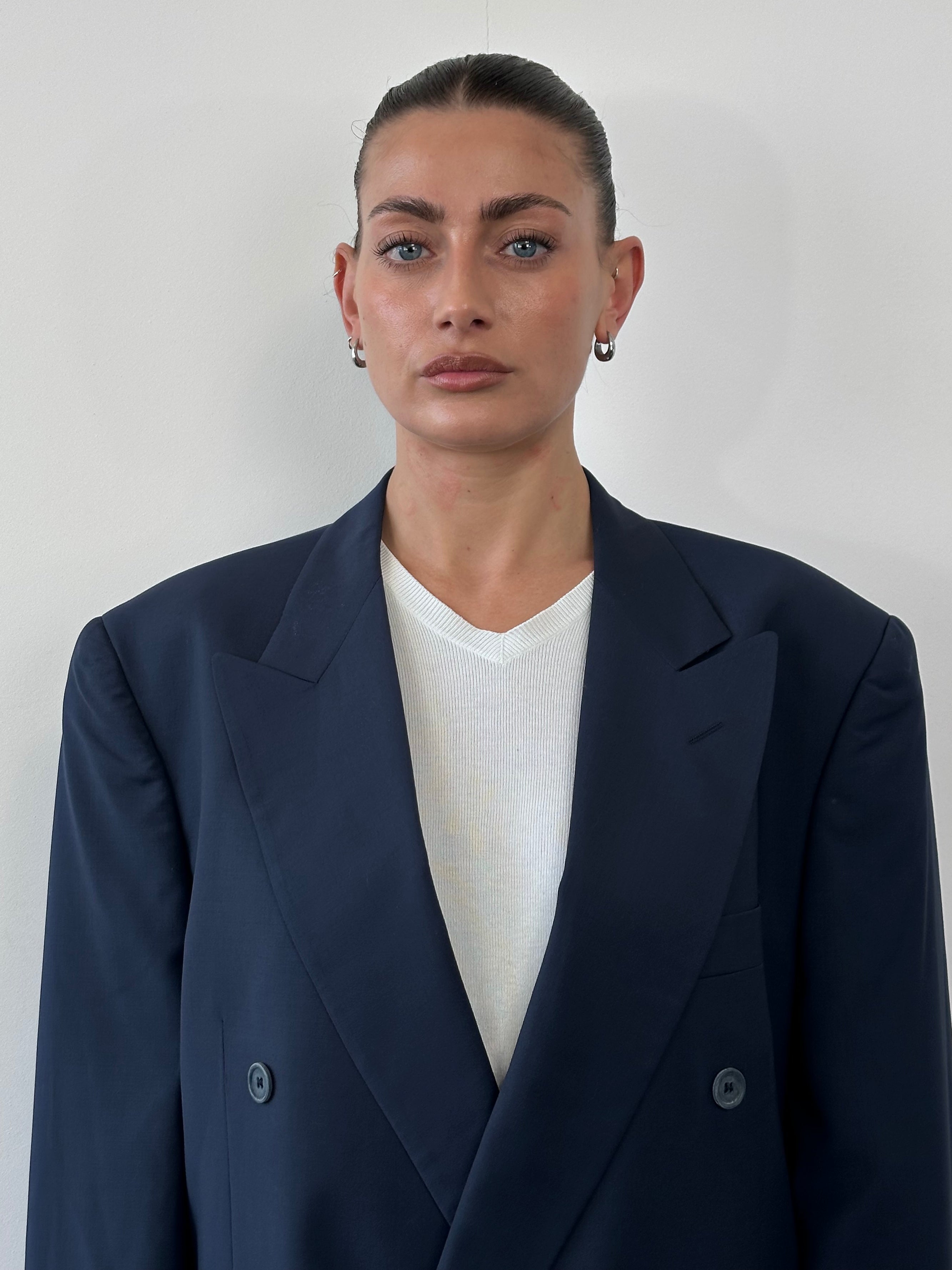 Vintage Italian 1990s double-breasted blazer made from pure Tasmanian wool in size 42R/XL, featuring classic tailoring and timeless style.