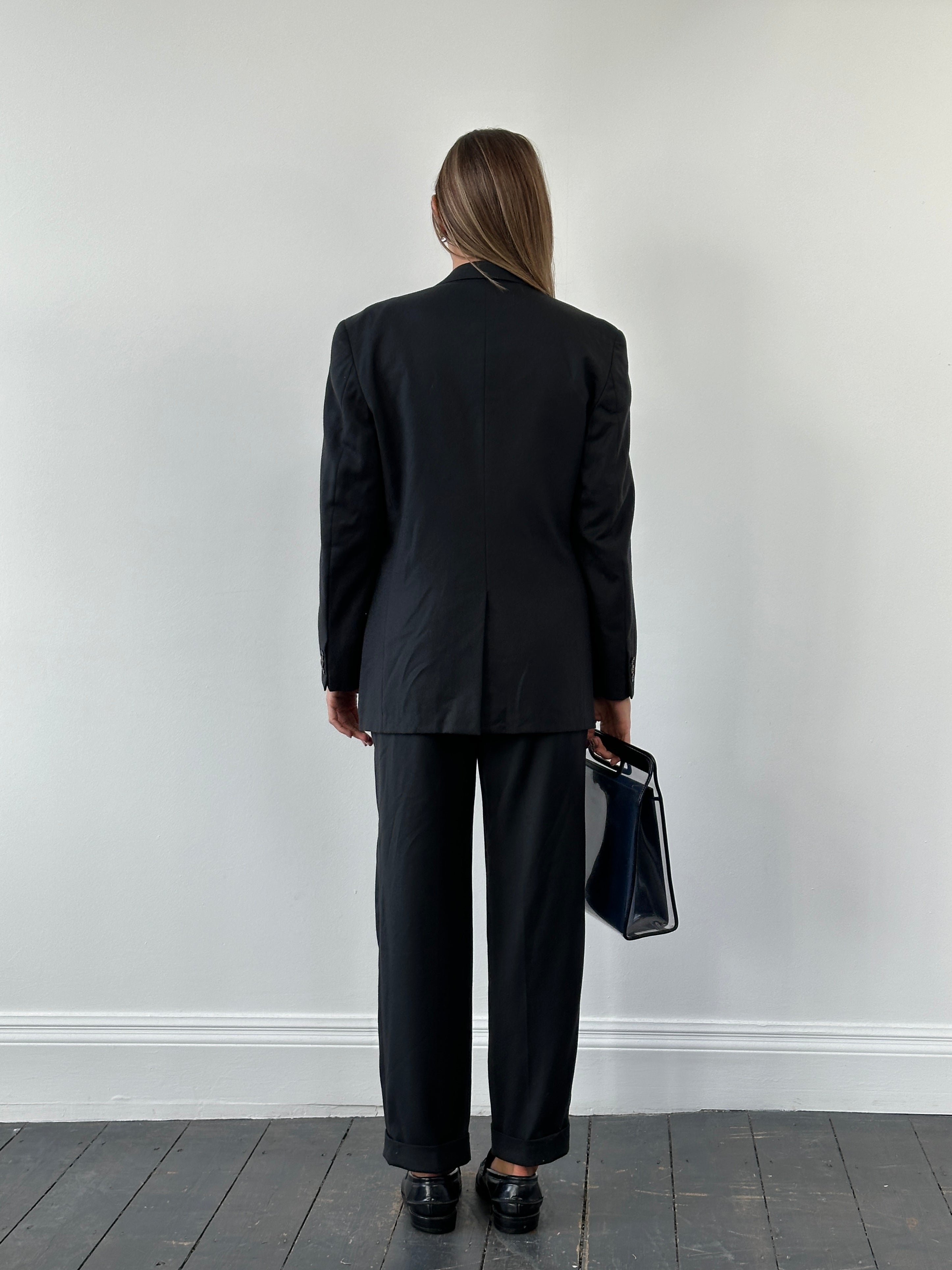 Vintage Japanese 1990s pure wool straight-leg suit in size 40R/W26, featuring classic tailored design and neutral gray color.