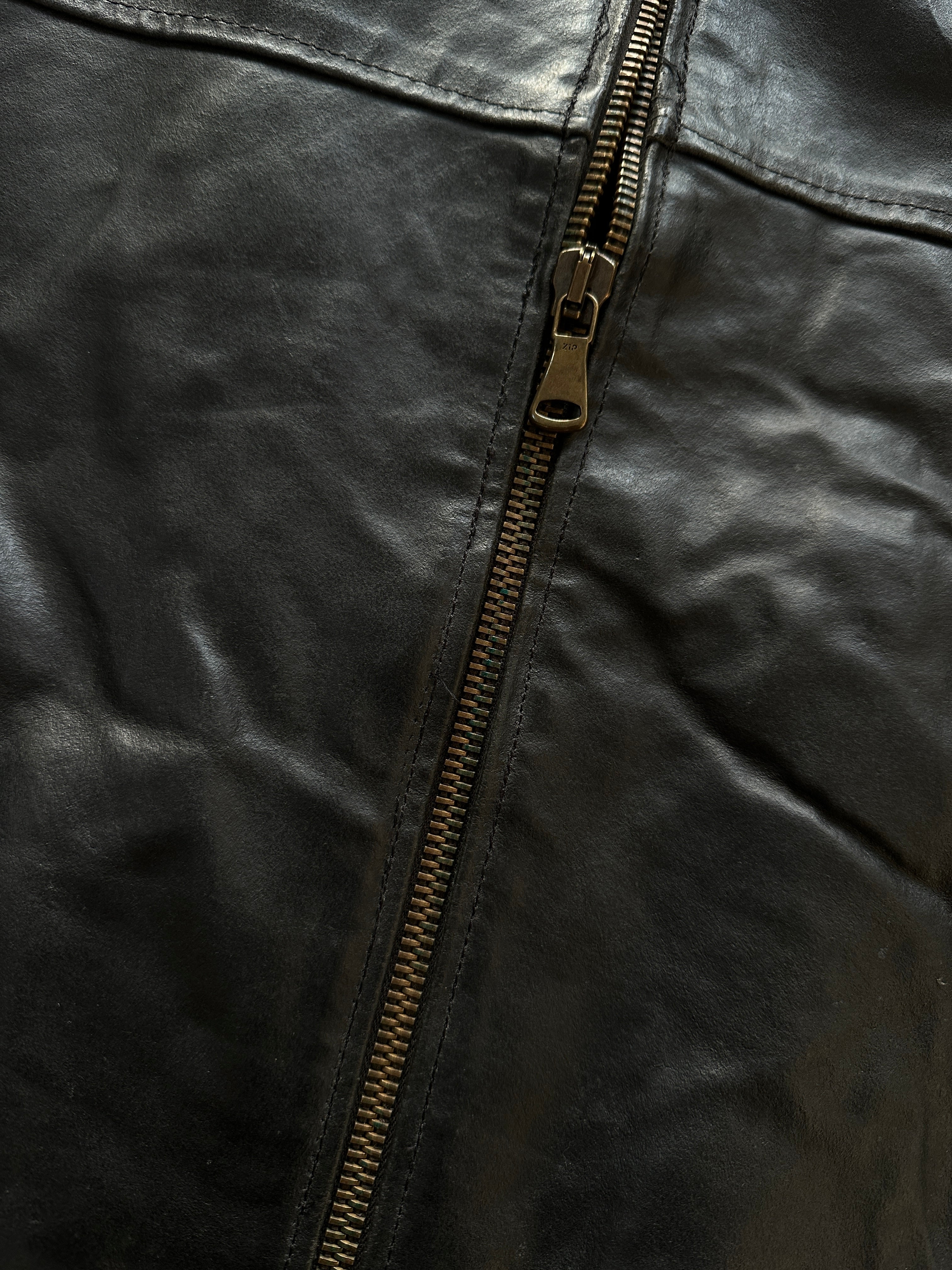 Vintage brand vintage leather jacket in size large, showing classic brown leather with detailed stitching and front zipper.