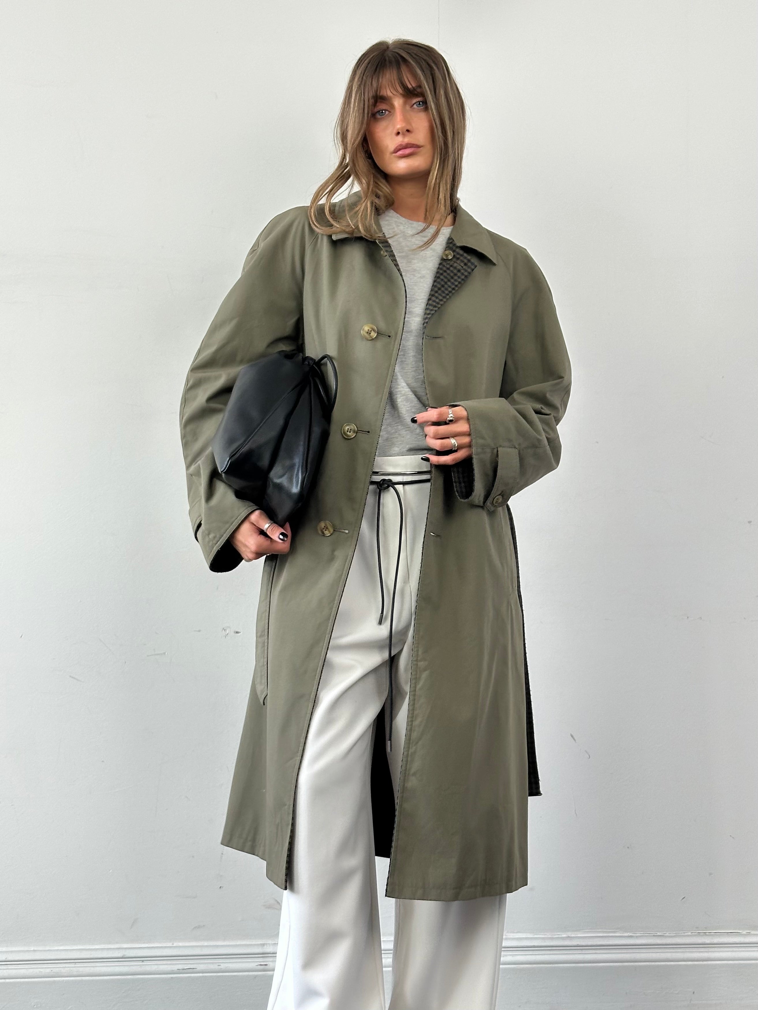 Vintage reversible wool trench coat with belt, oversized XL, featuring classic design and neutral tones, displayed on a hanger.