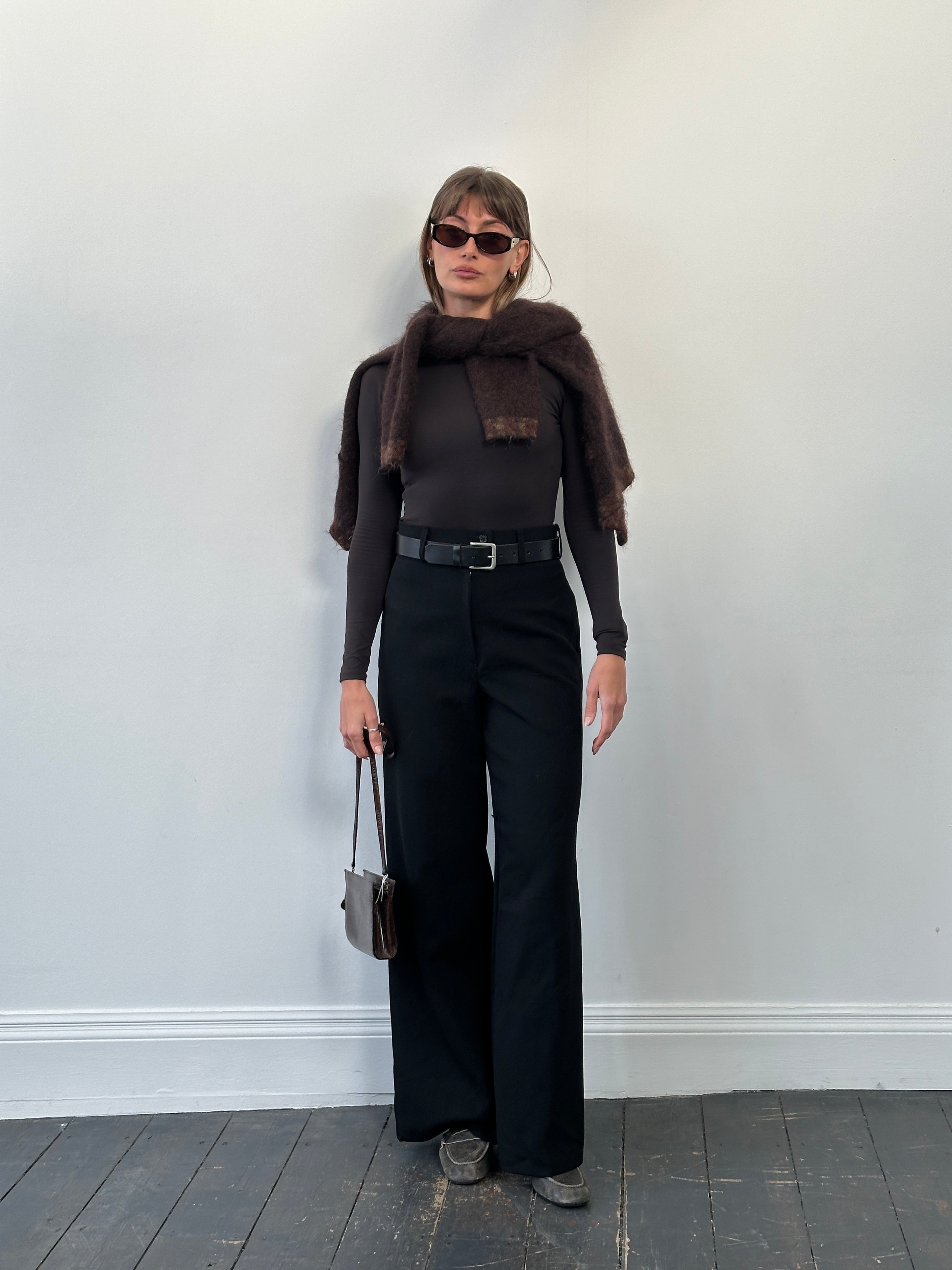 Vintage 1990s pure wool wide-leg tailored trousers in size W26, showcasing classic, high-waisted design and neutral fabric.