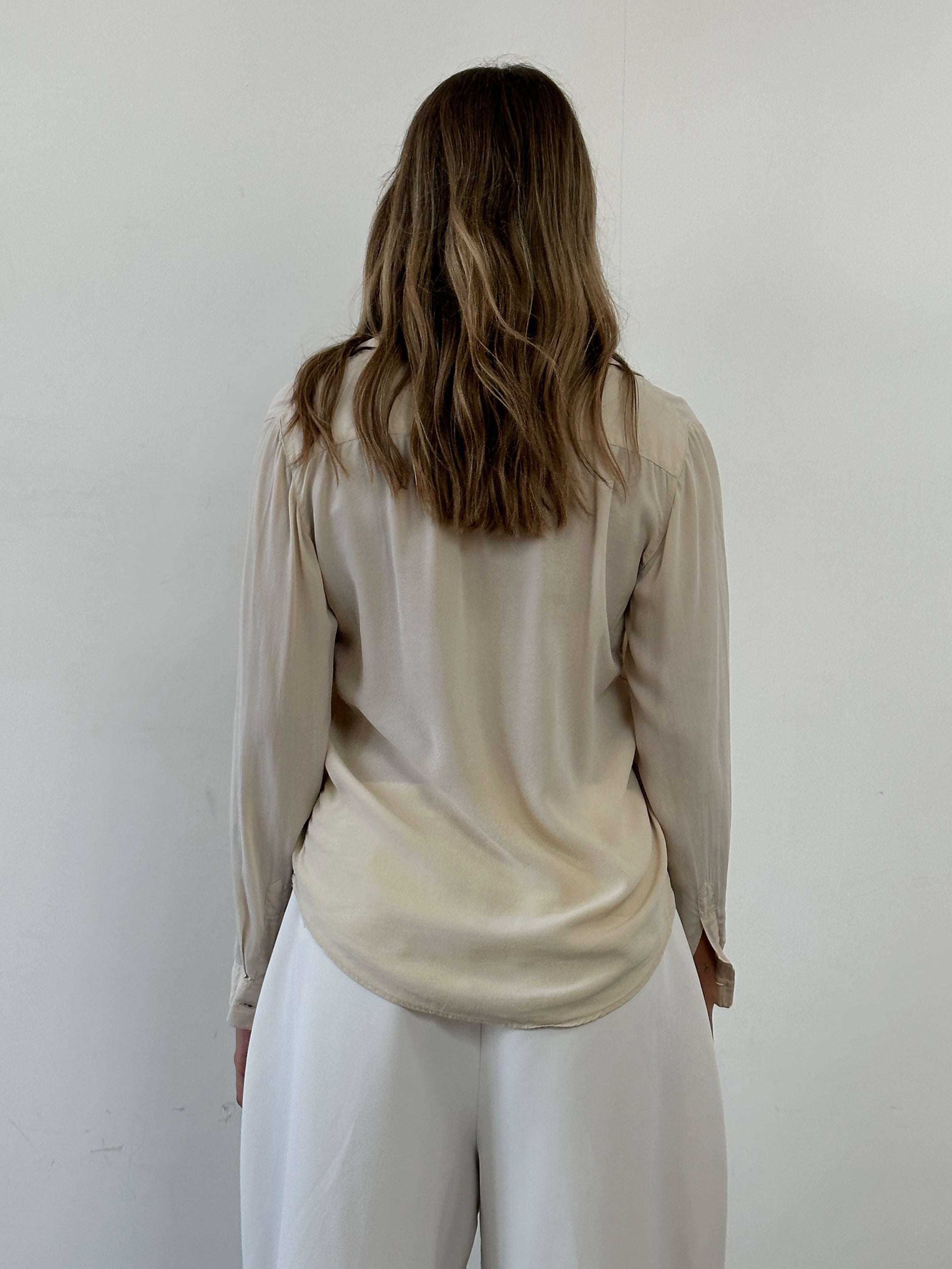 Vintage Italian vintage pure silk blouse with concealed placket, short sleeves, and elegant design, size small.