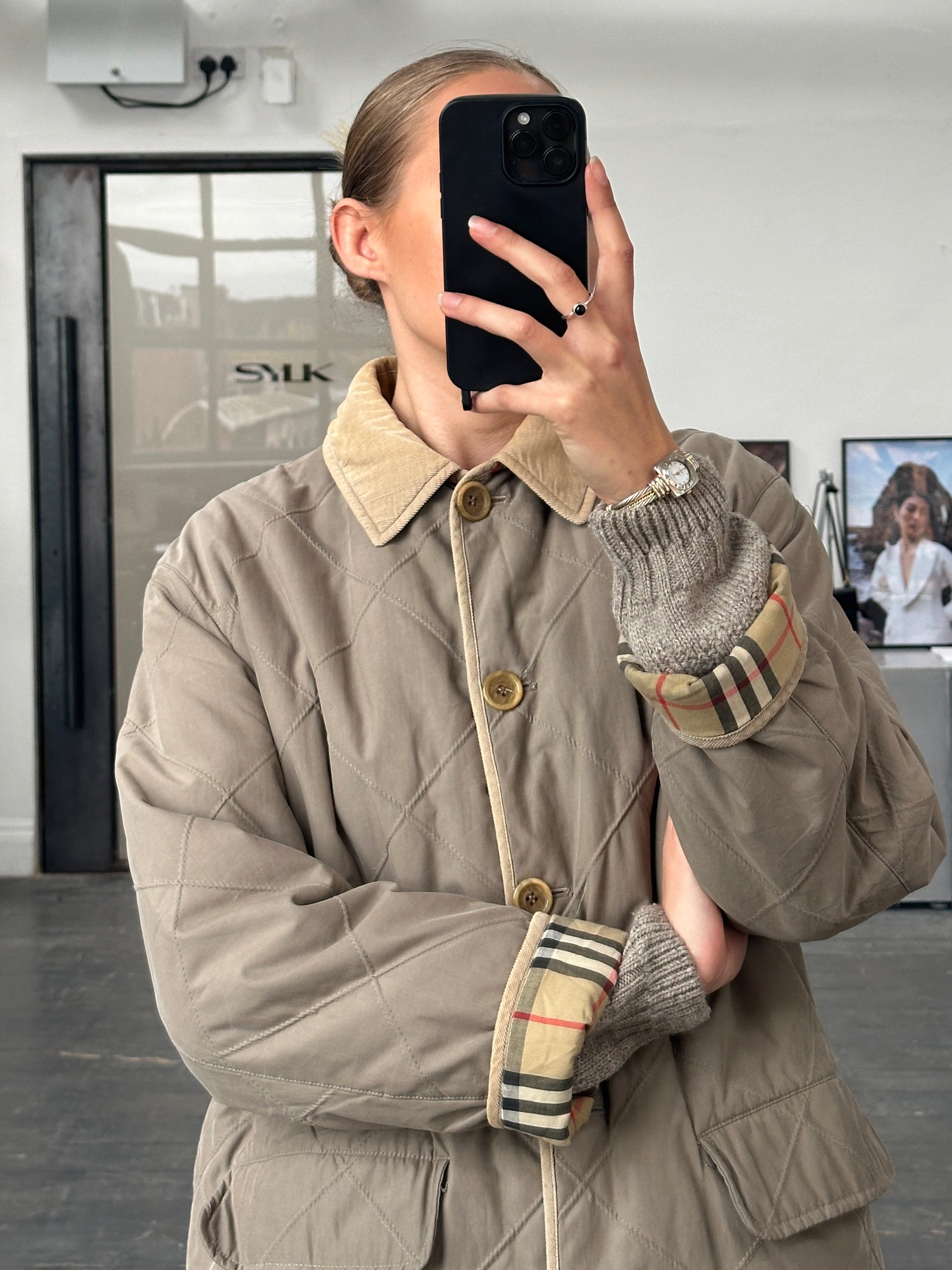 Burberry 1990s quilted Nova Check cord collar coat in beige with signature plaid pattern and front button closure, size large.