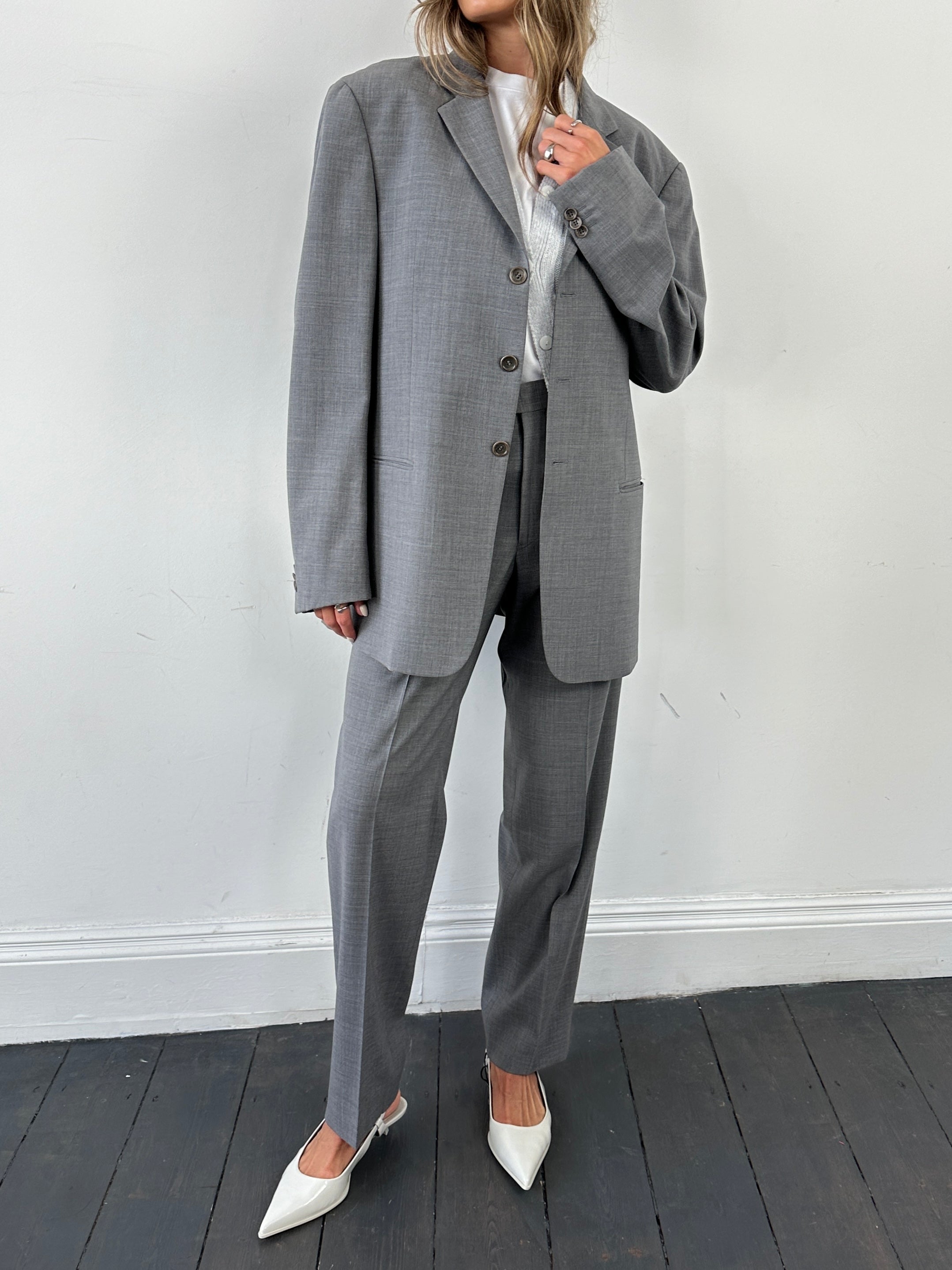 Armani Collezioni relaxed virgin wool single-breasted suit jumpsuit, size 40R/W32, in a tailored design.