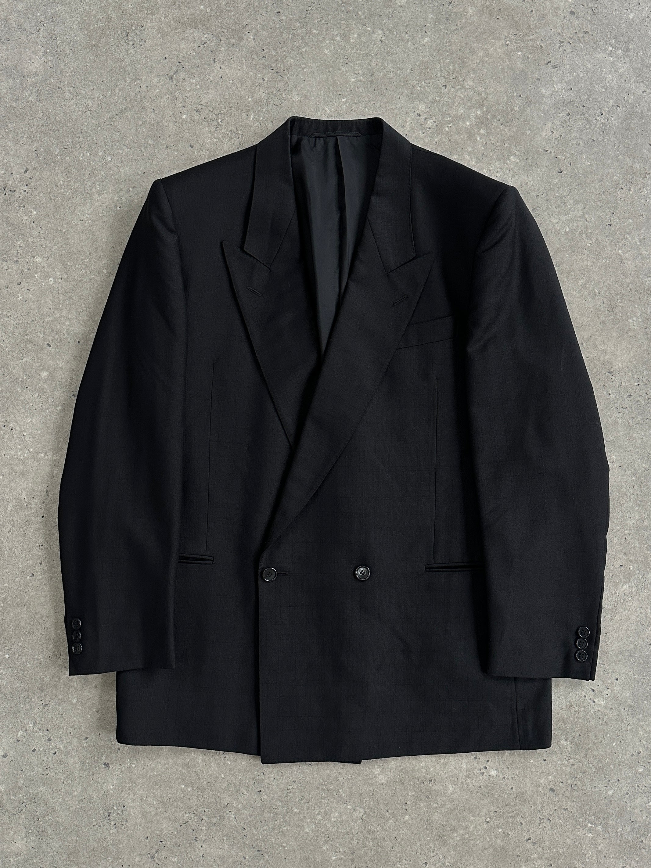 Vintage wool double-breasted blazer in size 40R, featuring classic design and tailored fit with notch lapels and front buttons.