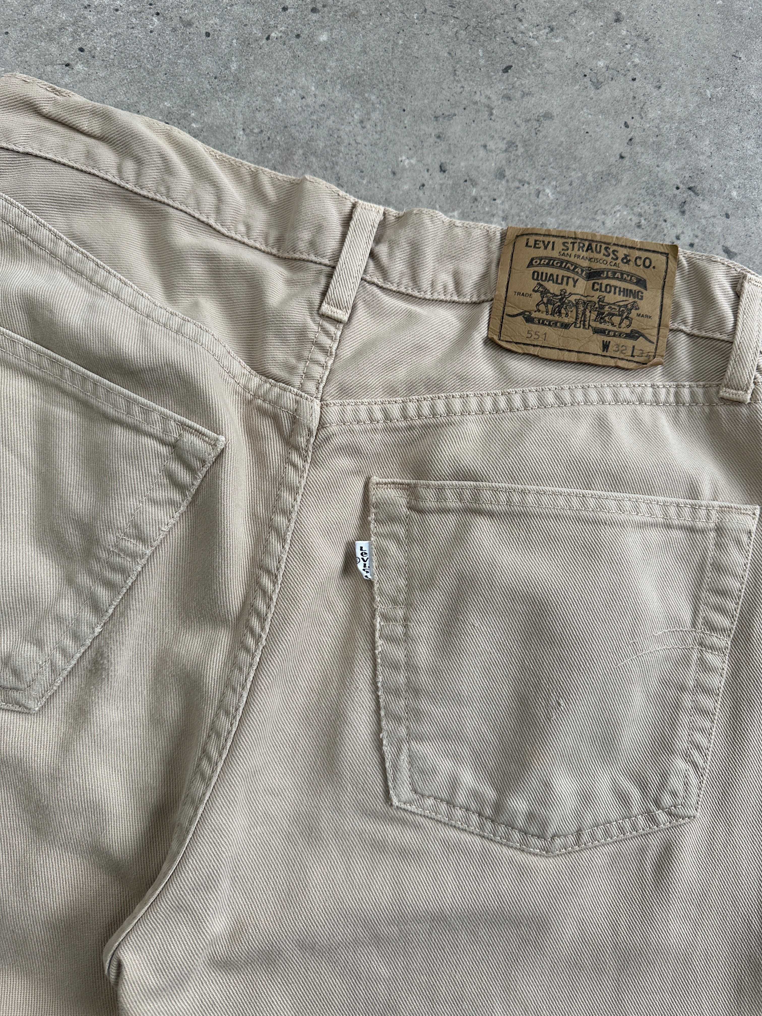 Levi’s 551 Straight Leg Denim Jeans in W30, folded flat showing classic blue denim with visible stitching and five-pocket design.