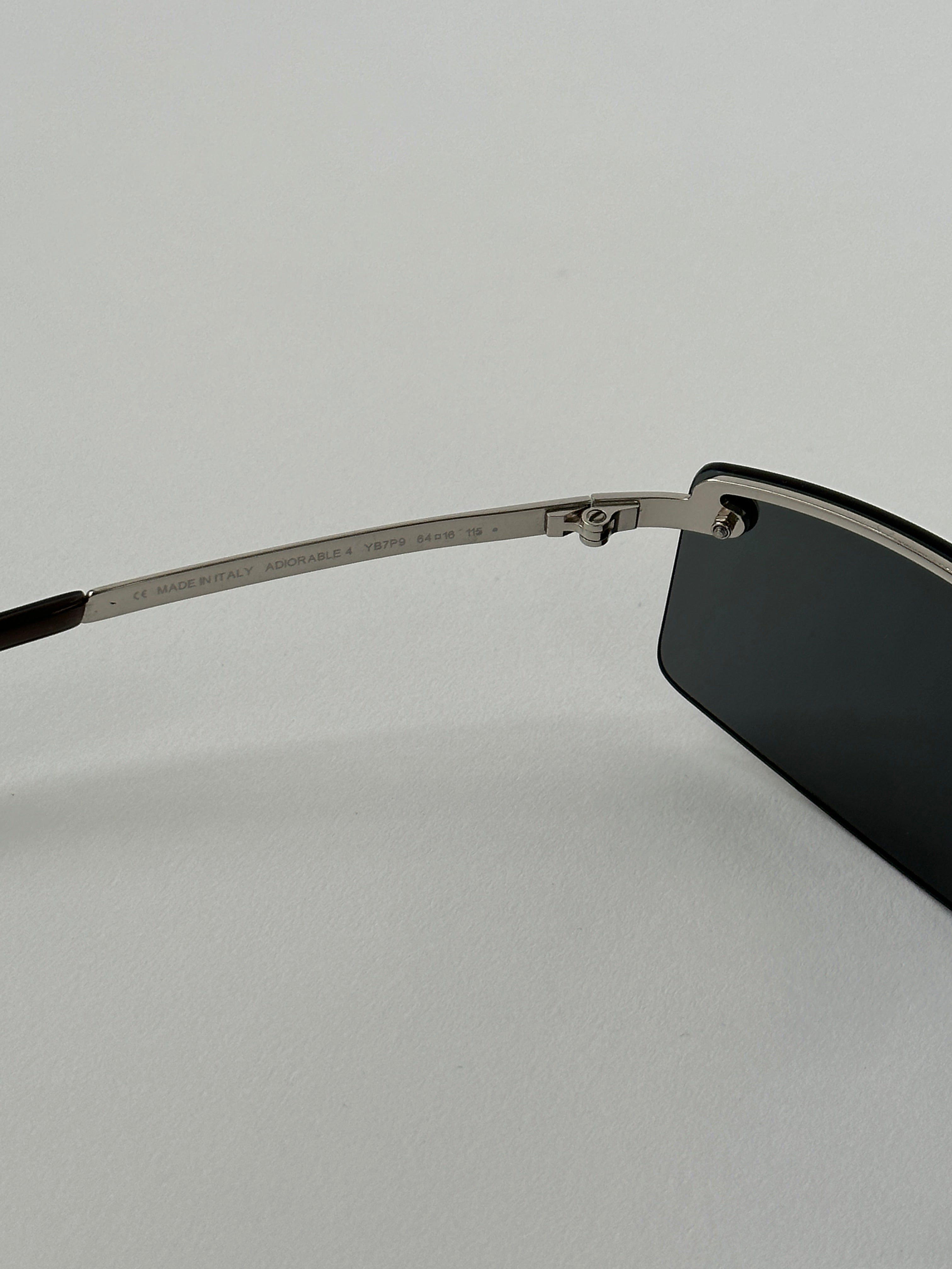 Christian Dior 2000s rimless sunglasses with sleek, minimalist design and clear lenses, showcasing a modern eyewear style.