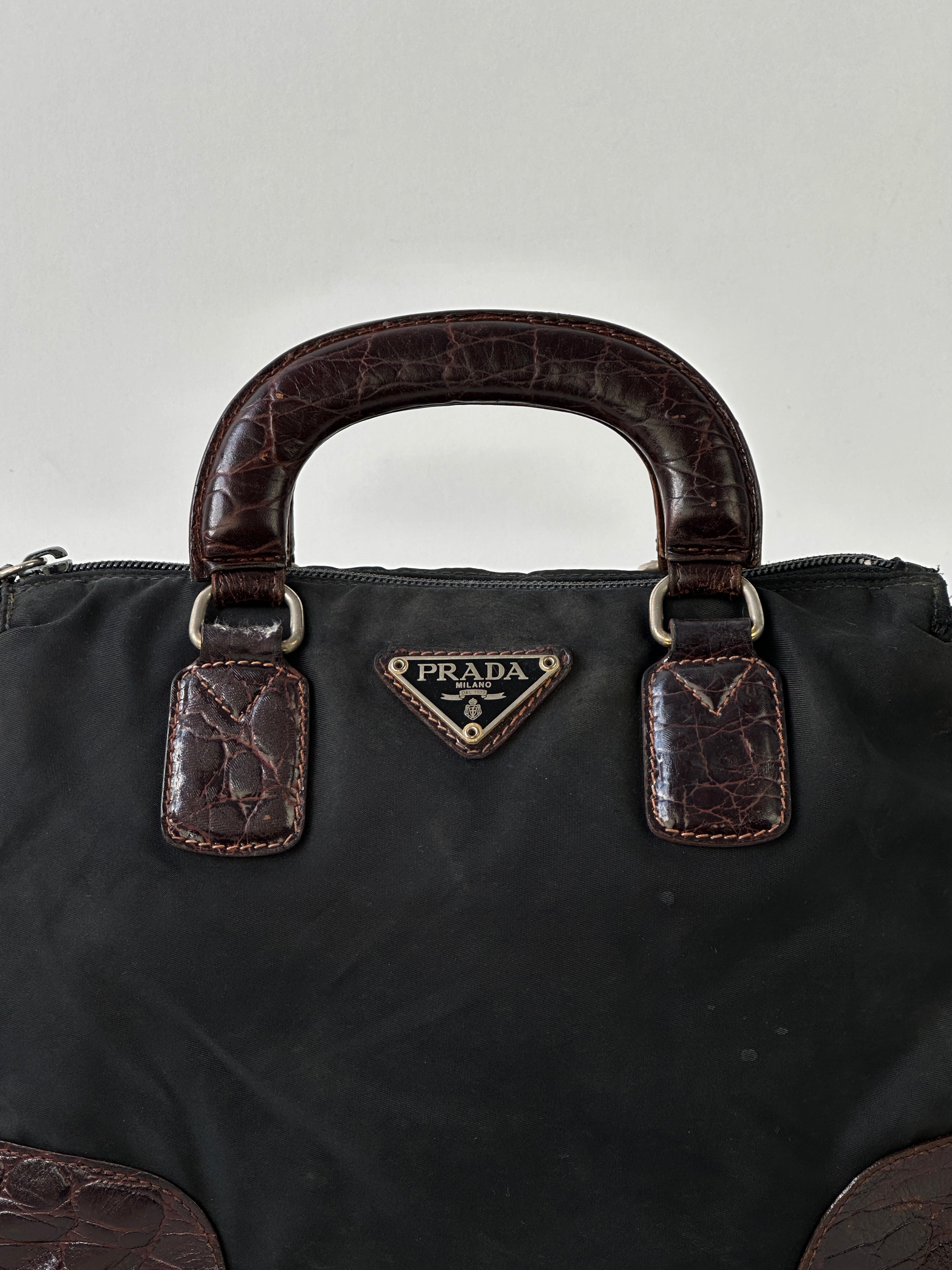 Prada nylon croc handbag featuring a sleek design with textured croc pattern and sturdy nylon material, stylish and functional.