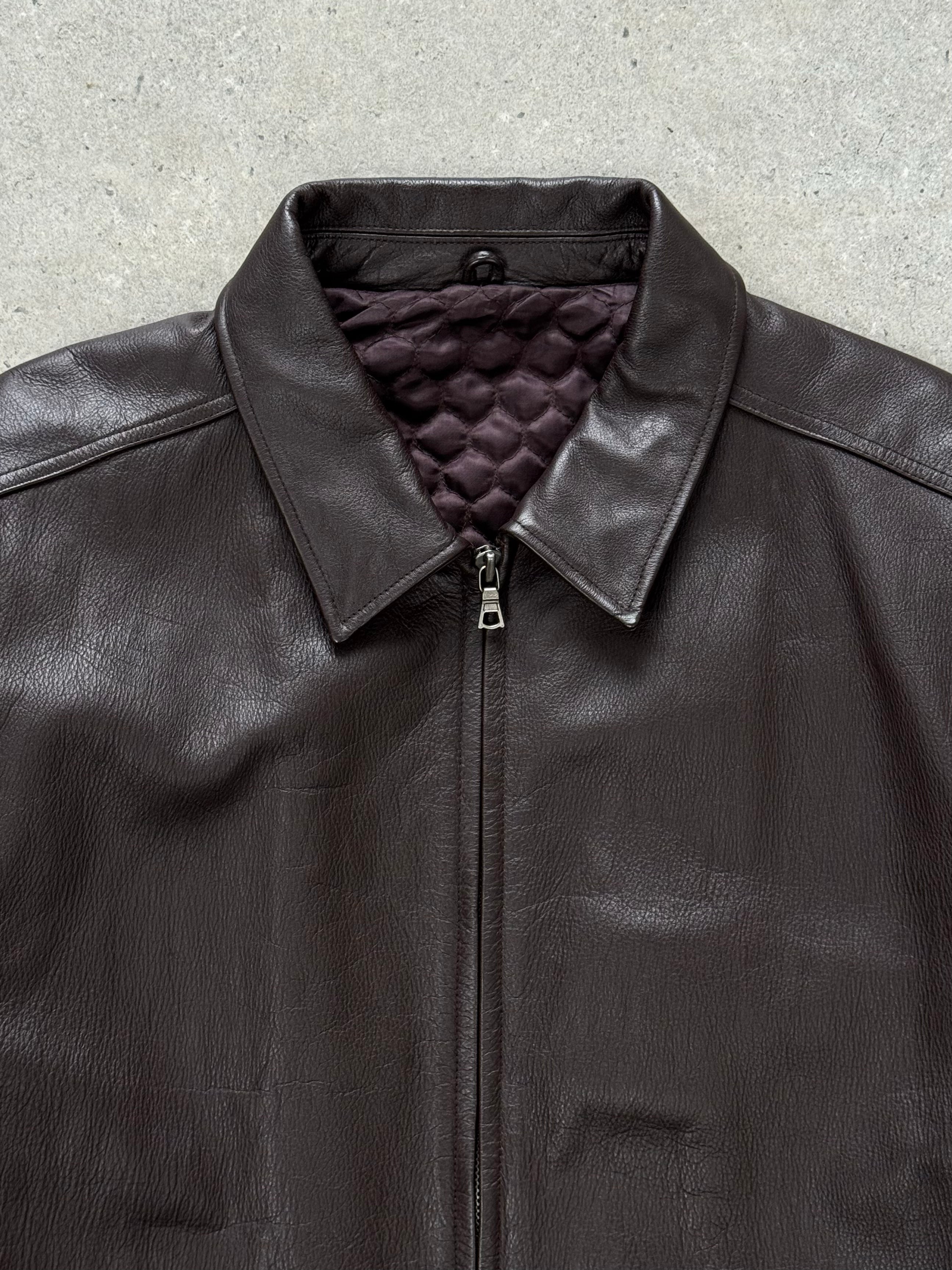 Vintage 1990s boxy minimal leather jacket in XL, featuring a classic design with clean lines and authentic leather texture.