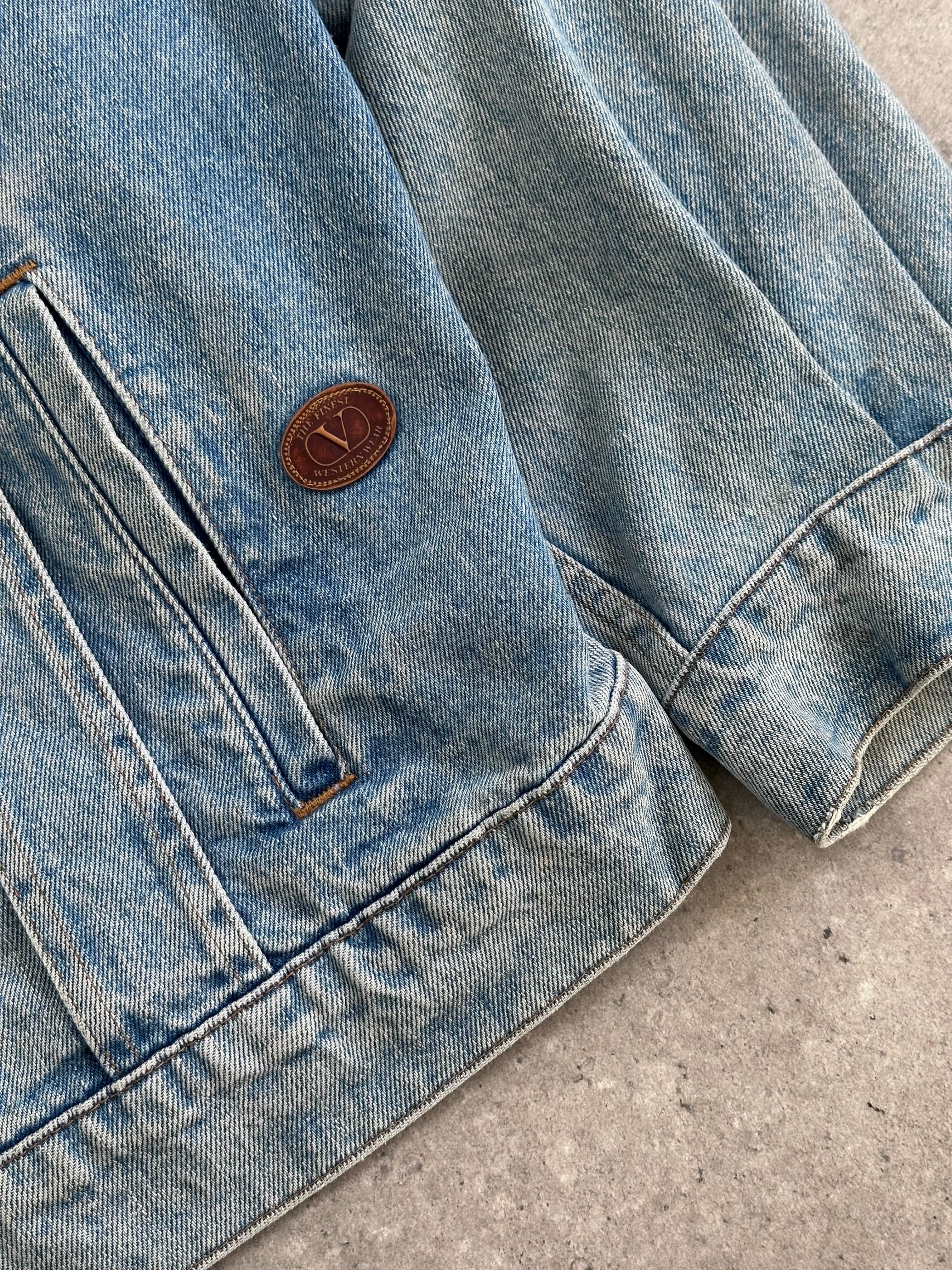 Valentino denim jacket in size XL, featuring classic blue denim with stylish stitching and button closures.