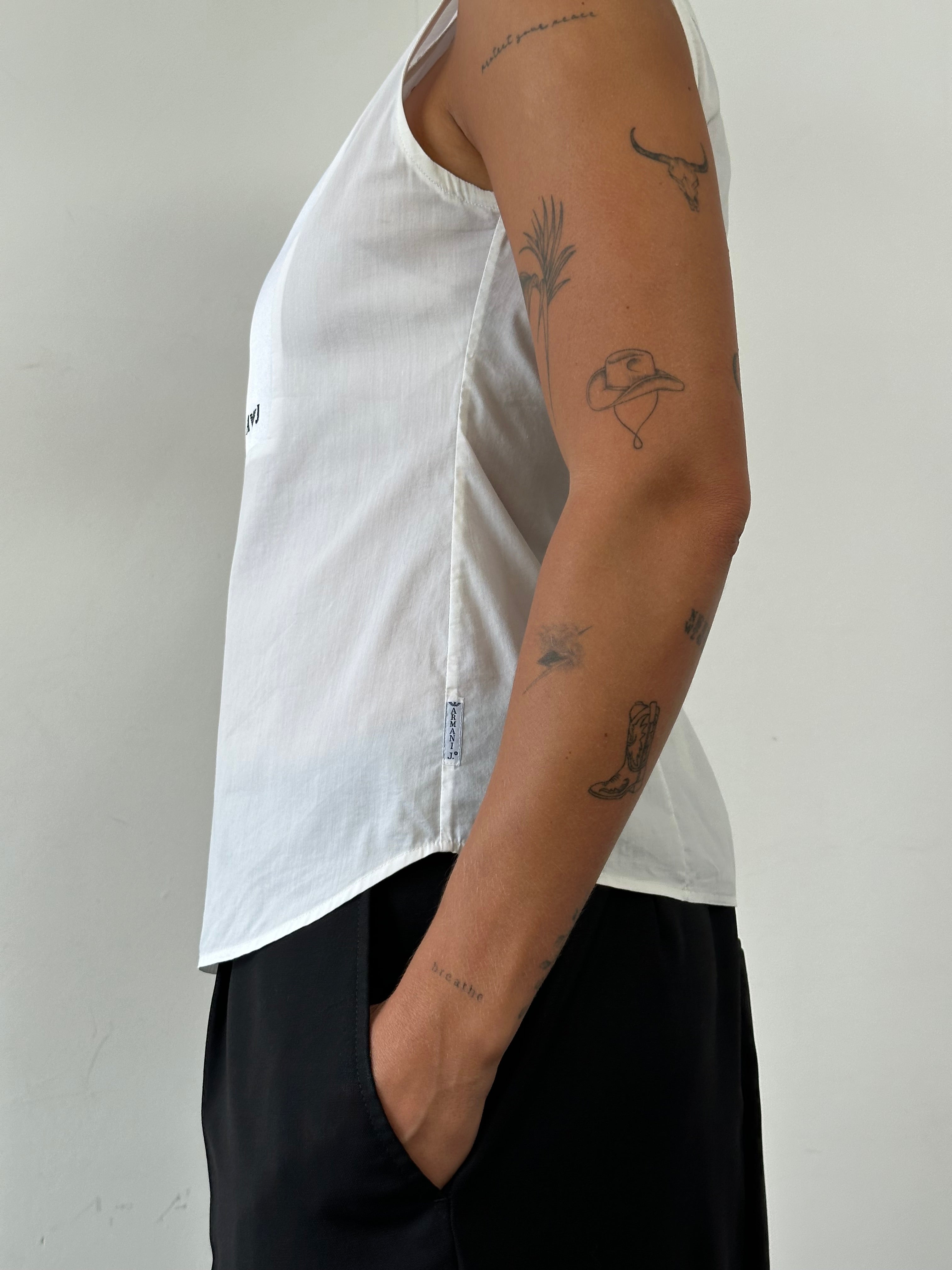 Armani Jeans sleeveless shirt in size S, featuring a stylish design with a collar and sleeveless cut, made from lightweight fabric.