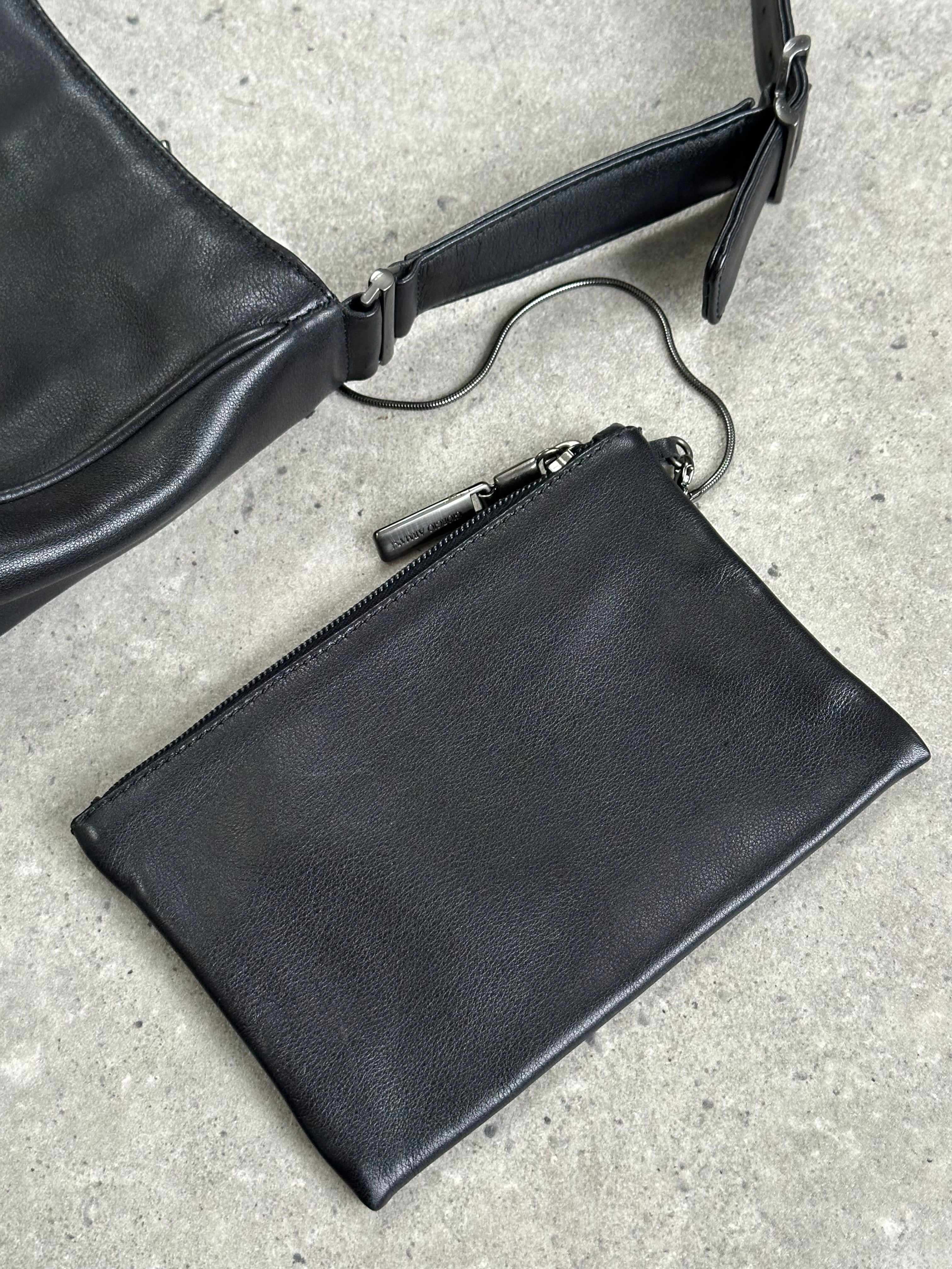 Giorgio Armani 2000s leather shoulder bag with sleek design, featuring smooth leather and classic metallic hardware.