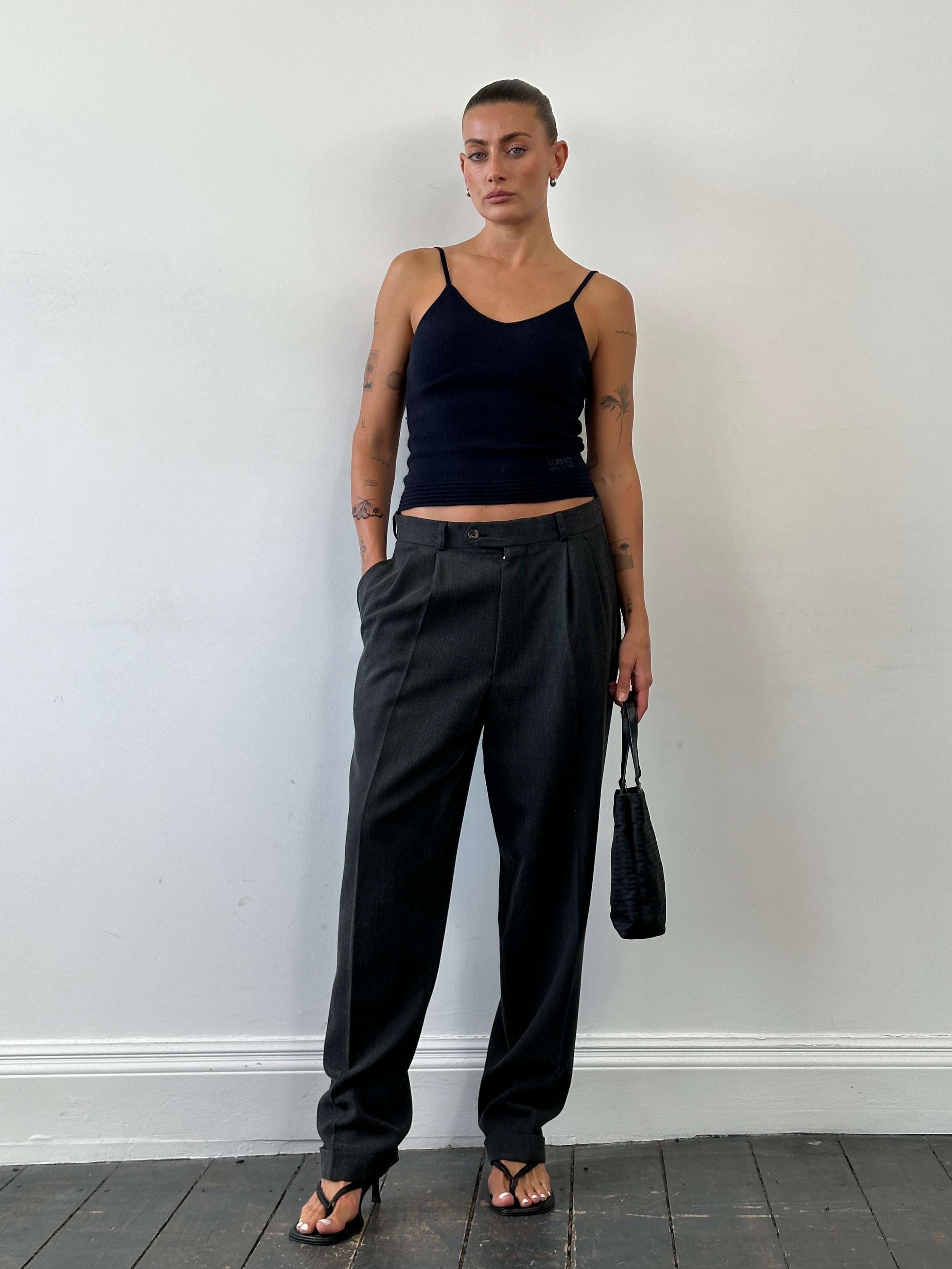 Vintage high waisted woven pleated tailored trousers in size W30, featuring a classic design and structured fit.