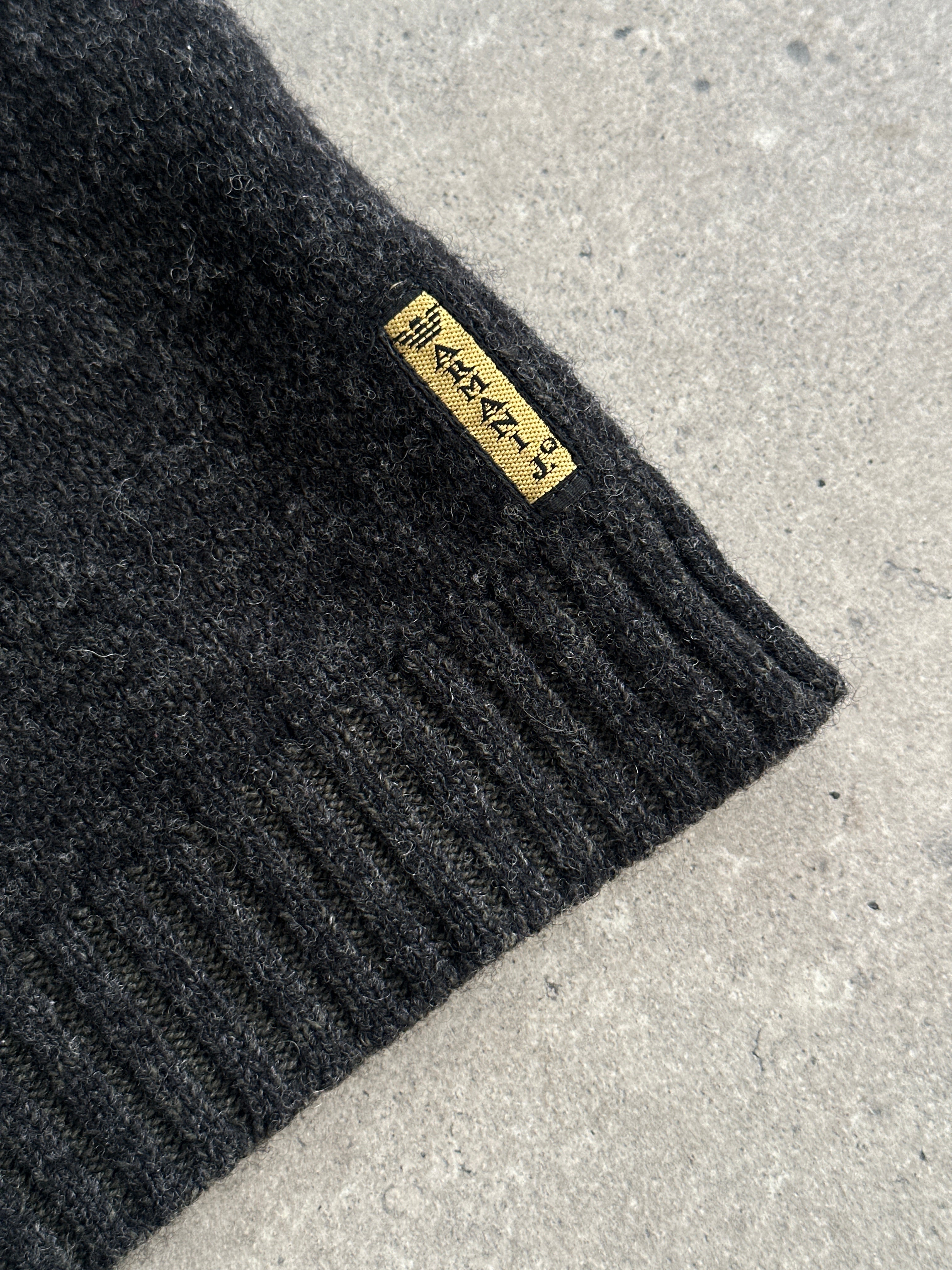 Armani Jeans wool V-neck jumper in size M/L, cream color, featuring a soft knit fabric and classic V-neck design.