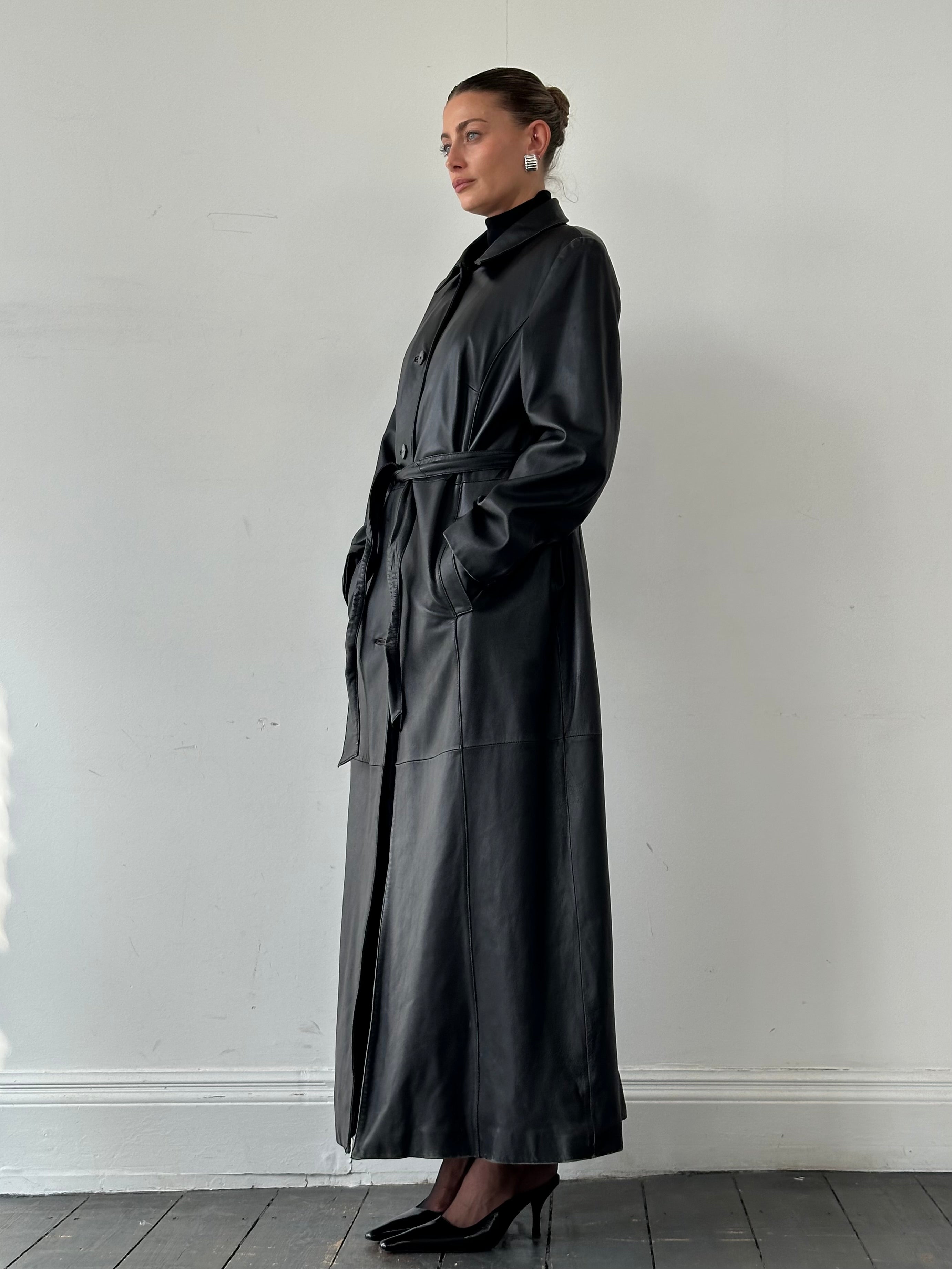 Vintage leather trench coat in XL with a floor-length design, belted waist, and classic leather jacket style.