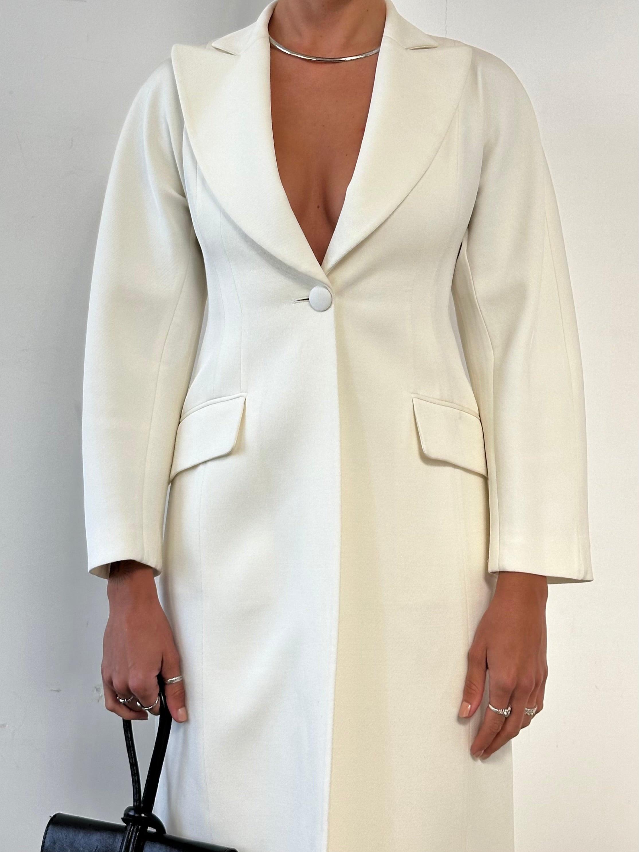 Emporio Armani wool blend fitted coat in size S, shown on a hanger with a tailored silhouette and classic design.
