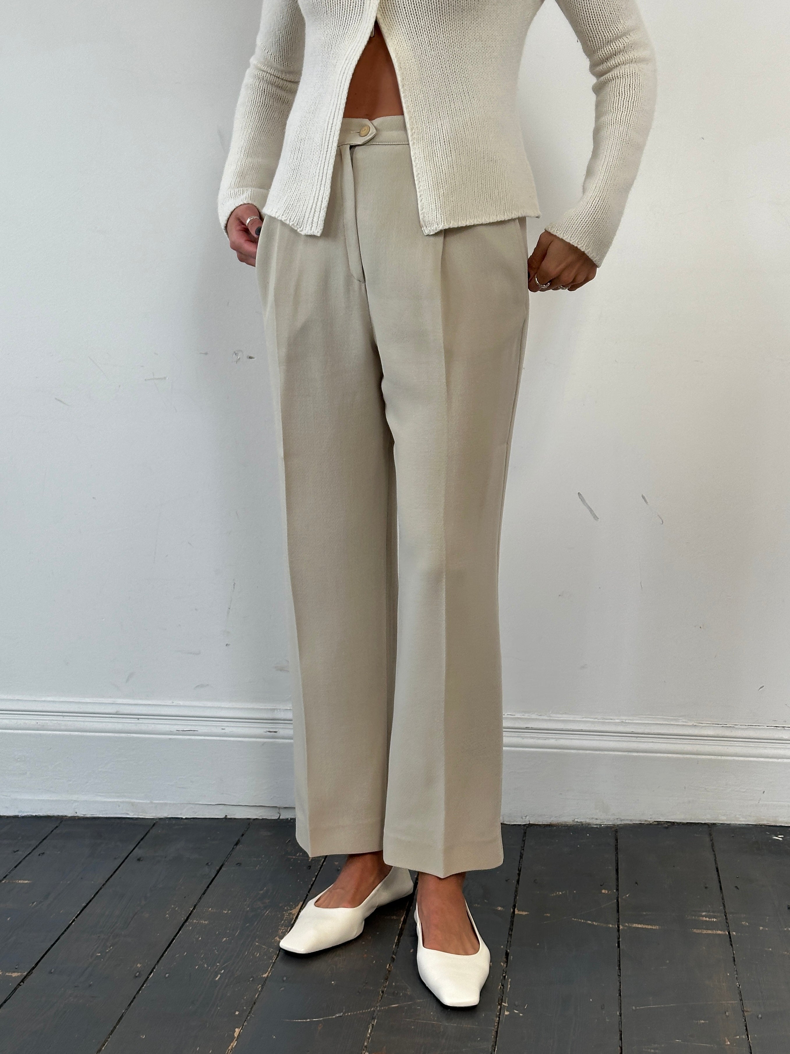 Max Mara pure wool straight leg tailored trousers in W28, displayed on a hanger with a classic fit and clean design.