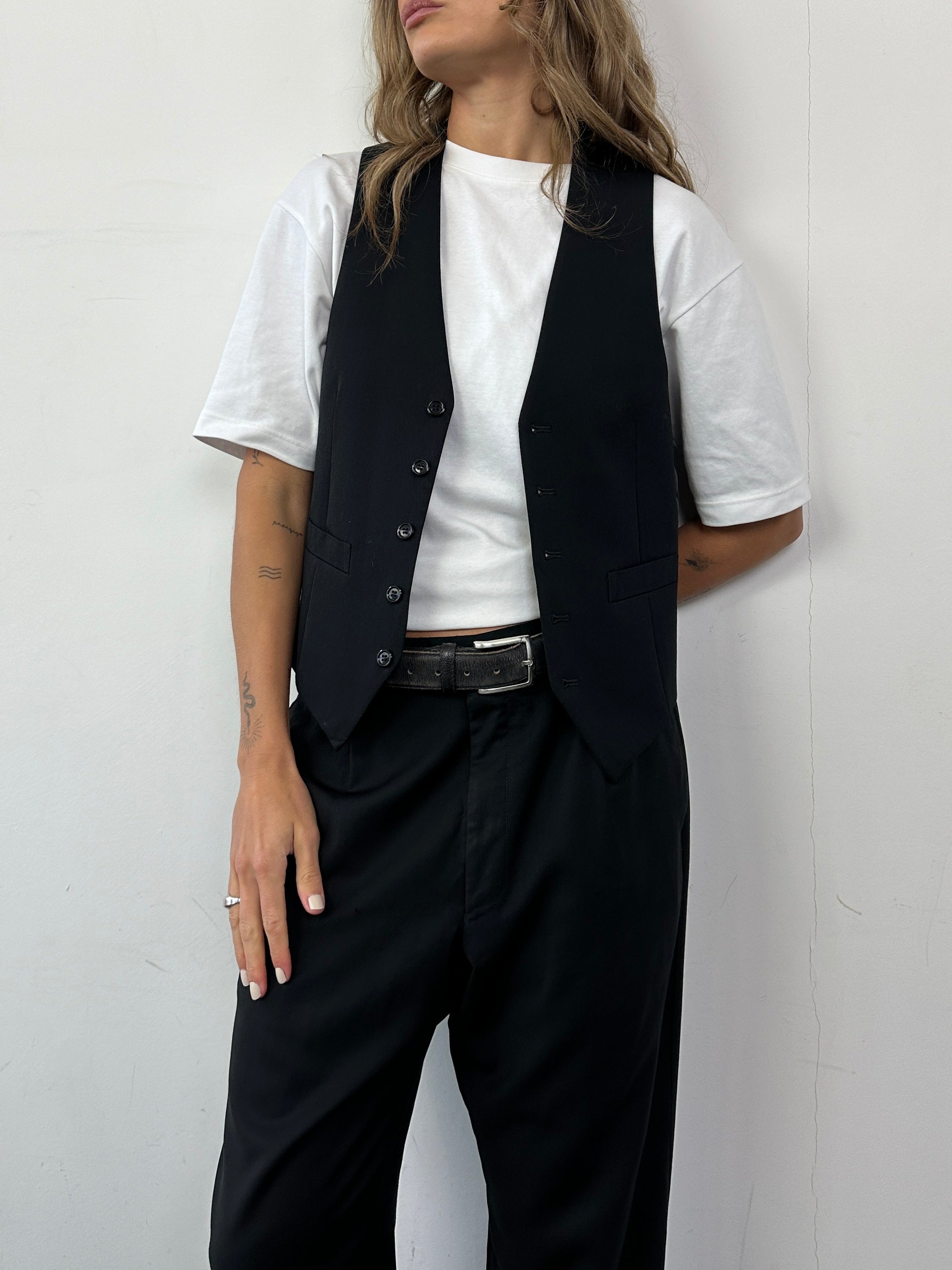 Vintage pure wool tailored waistcoat in size S, featuring classic design and detailed stitching.