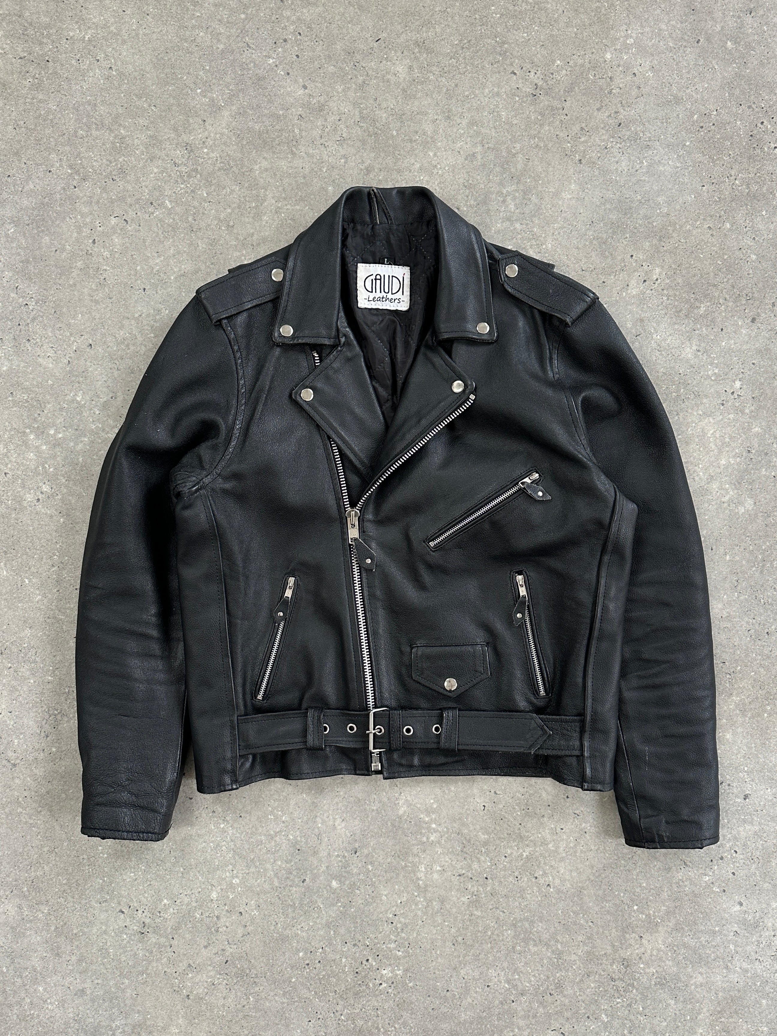Vintage leather biker jacket in size M/L, featuring classic design with rugged stitching and silver hardware.
