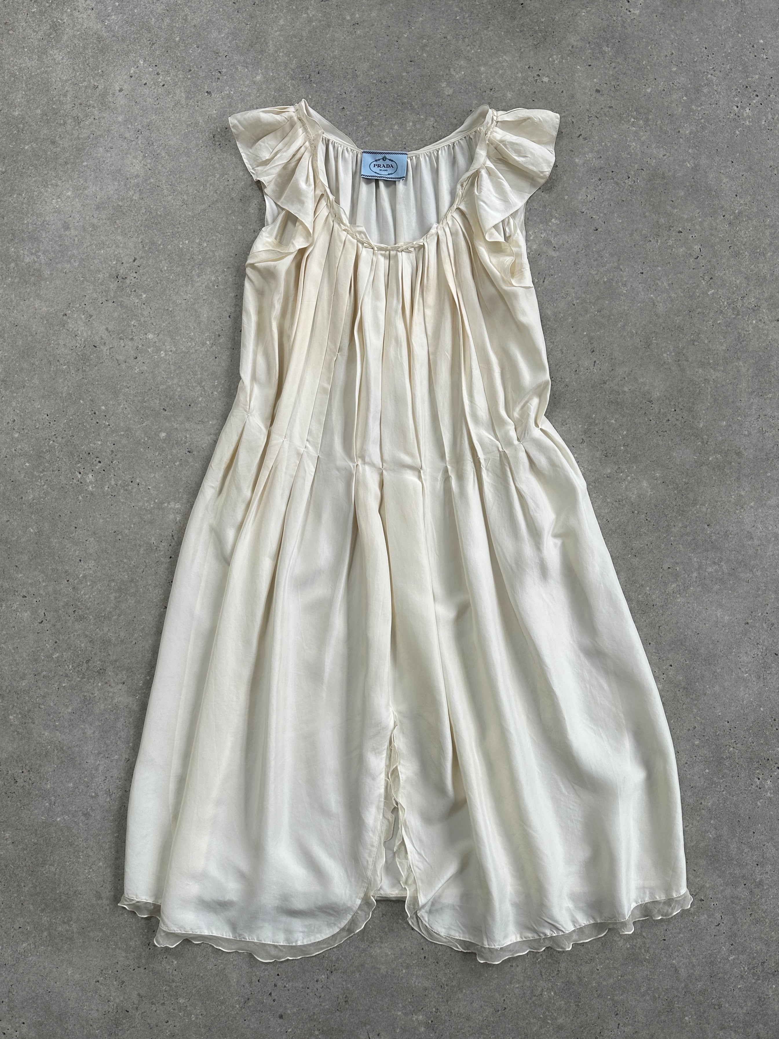 Prada 2012 pure silk pleated slip dress in size large, featuring elegant draped fabric and refined design.