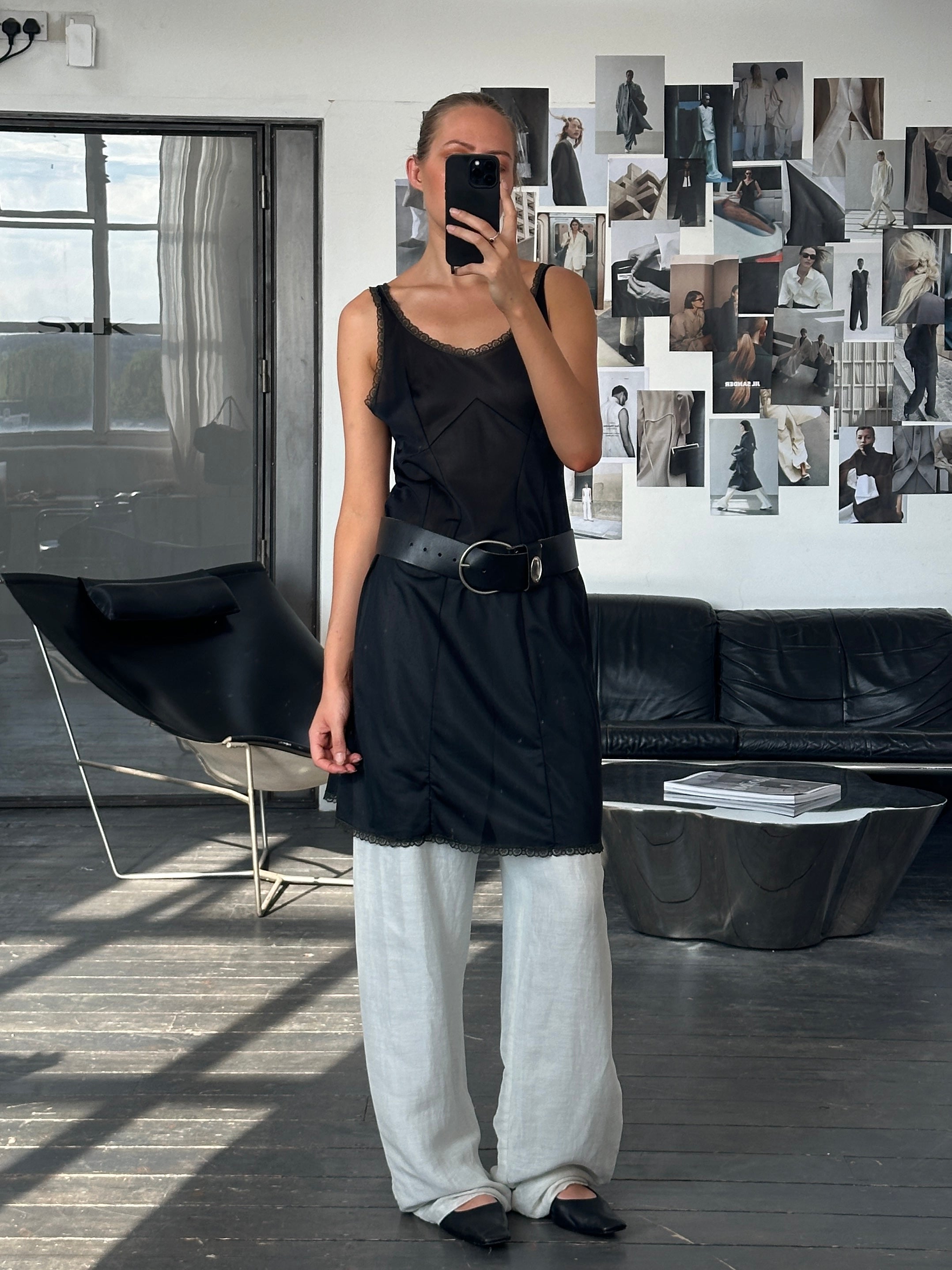 Vintage 1990s lace mini slip dress in size M, featuring delicate lace fabric and a classic mini length, styled for a vintage look.