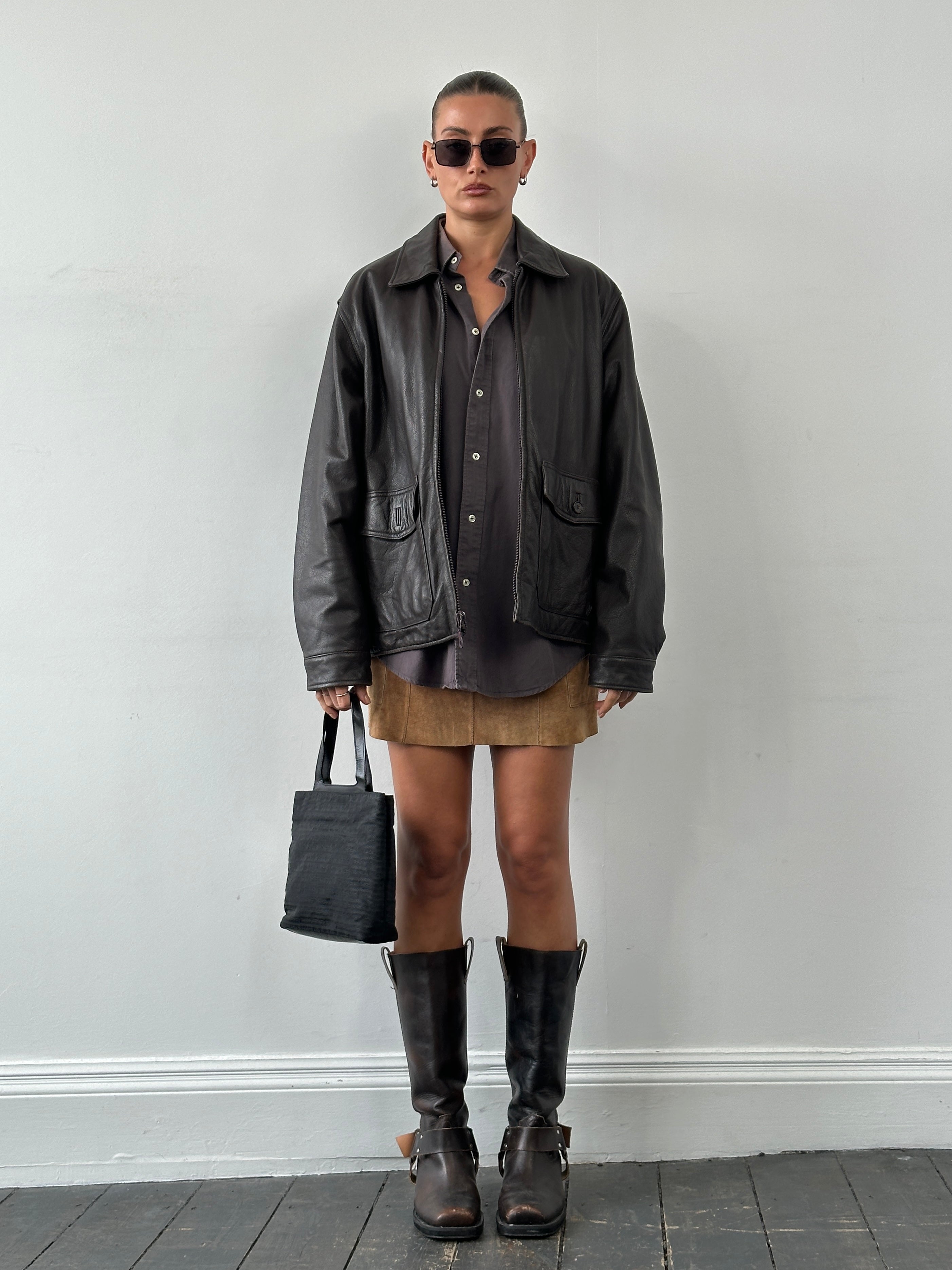 Vintage boxy leather jacket in size L, featuring a classic design with a stylish fit and detailed leather texture.