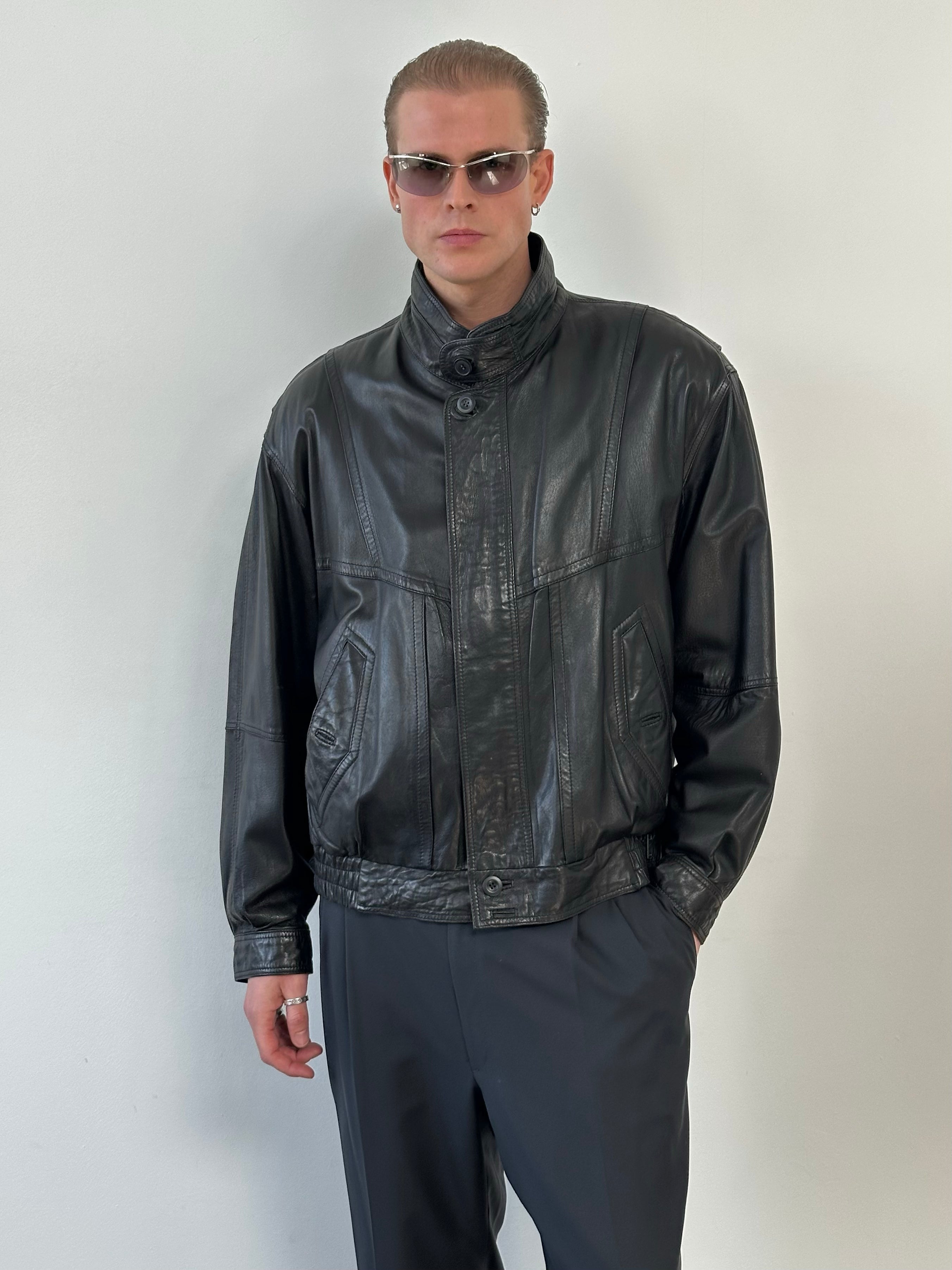 Vintage 1990s high neck leather blouson bomber jacket, large size, featuring a classic black leather design and high neckline.
