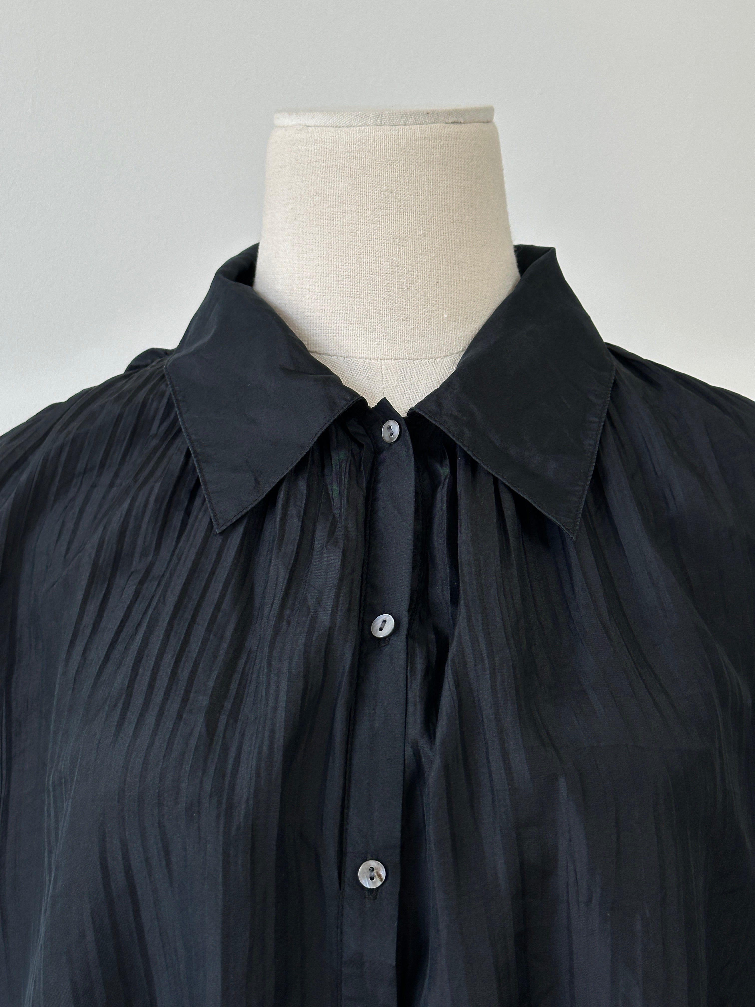 Vintage 1990s pure silk pleated shirt in size large, featuring a classic collar, long sleeves, and elegant pleats.