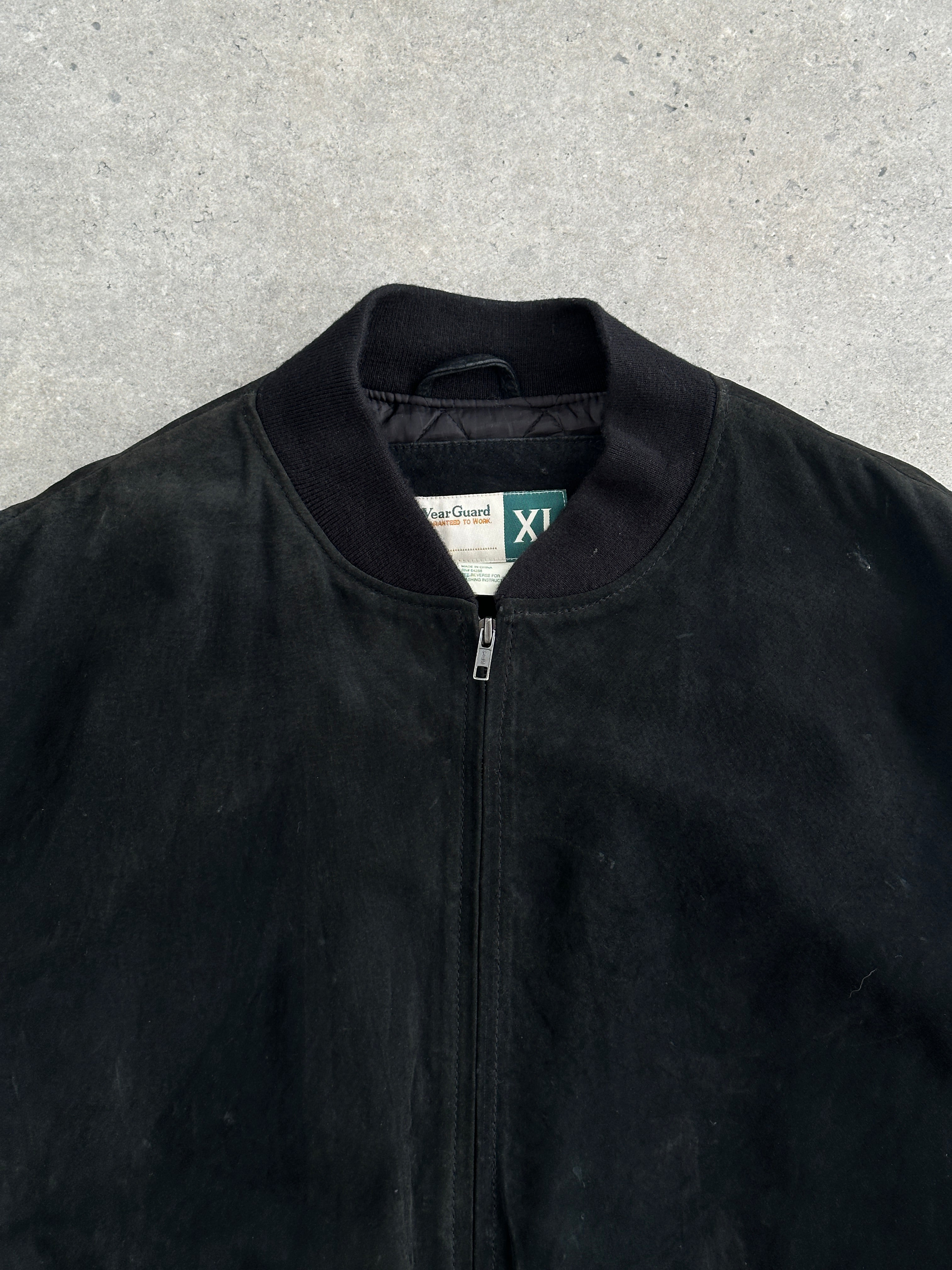 Vintage suede bomber jacket in XXL, stylish leather jacket with classic design and rich suede texture, displayed on a hanger.