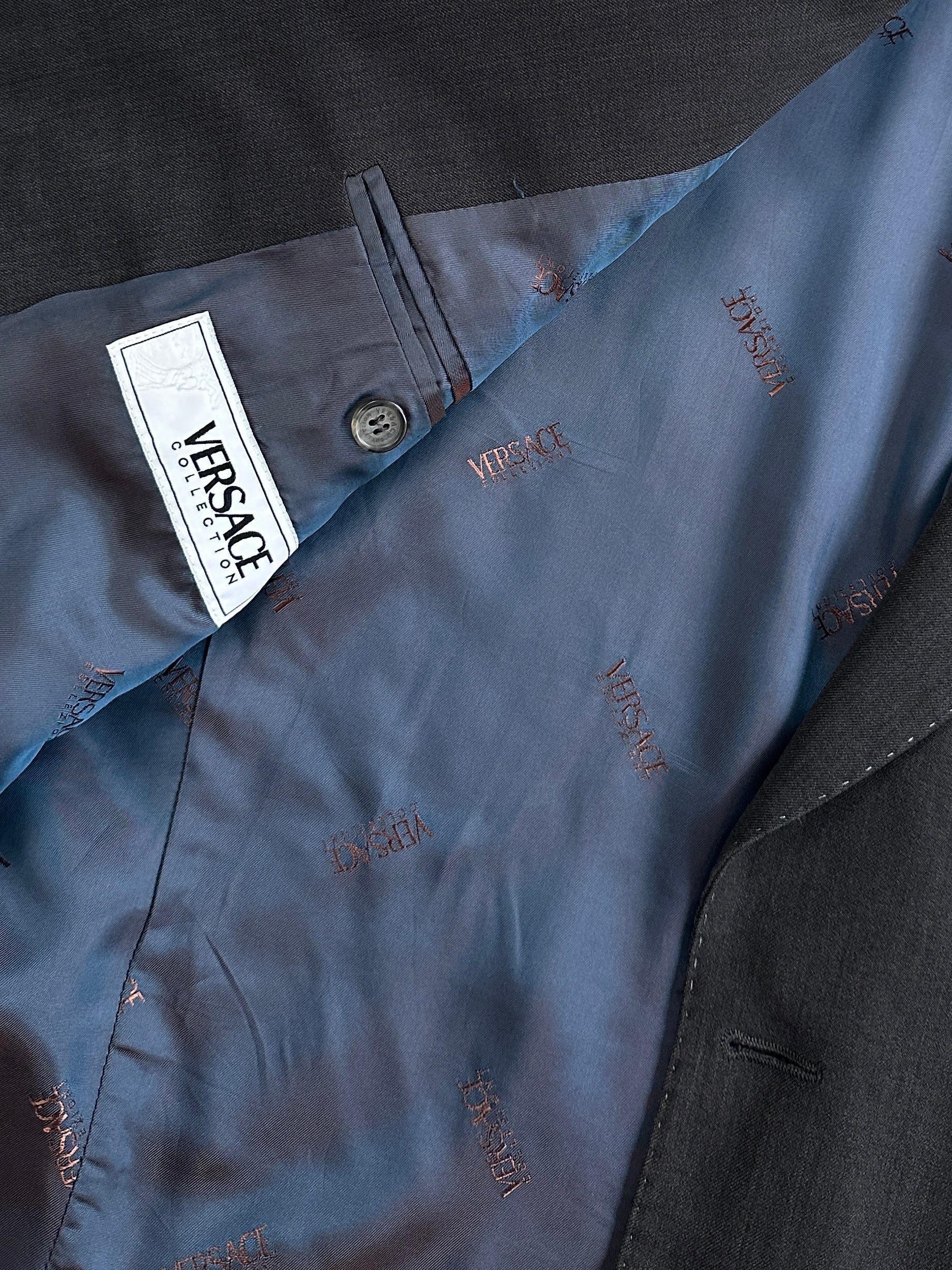 Versace Collection 2000s wool single-breasted blazer in size 42R/XL, tailored fit with classic lapel and button closure.