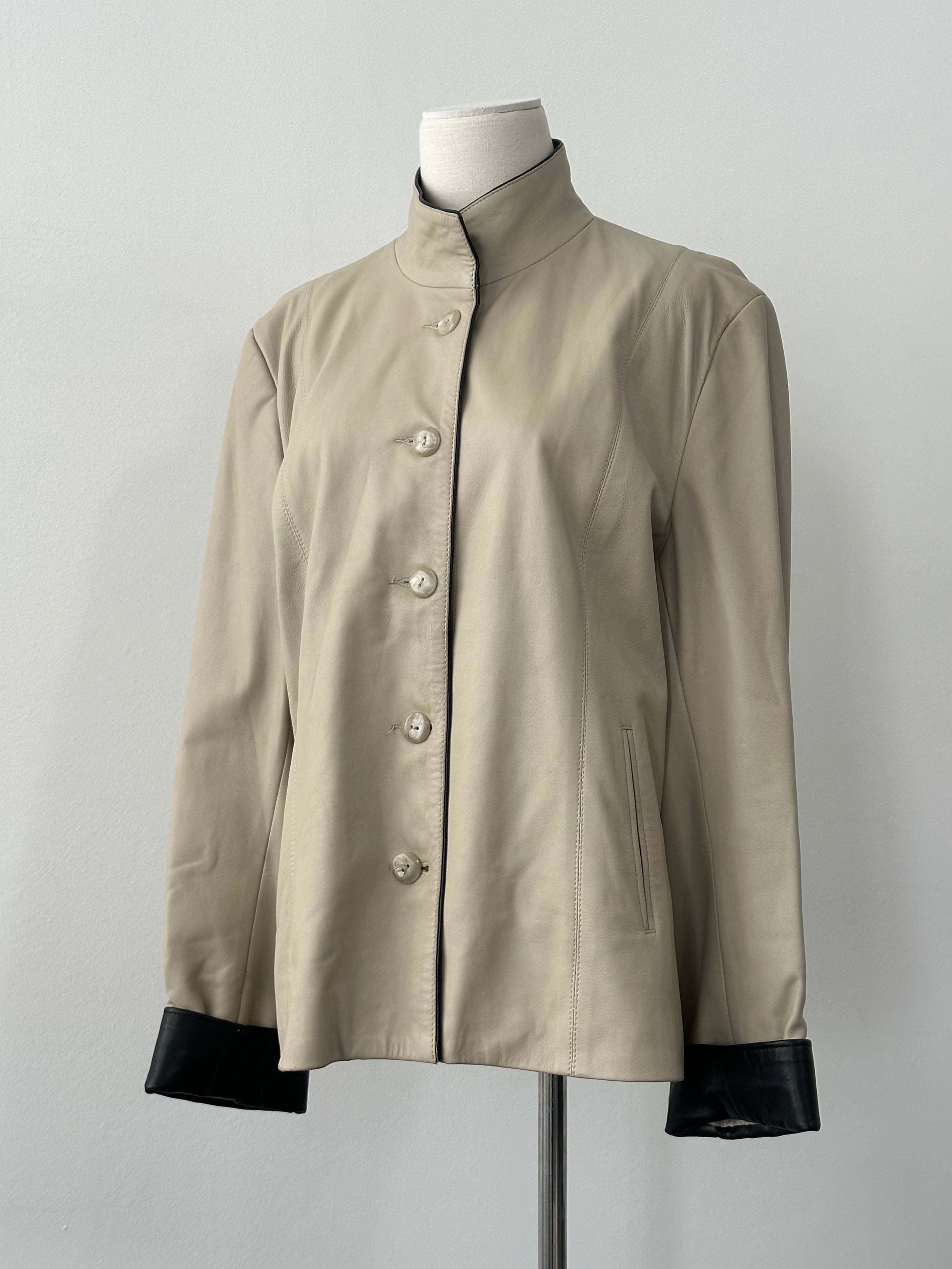 Vintage 1990s high neck contrast leather jacket, size M, with stylish design and classic leather texture.