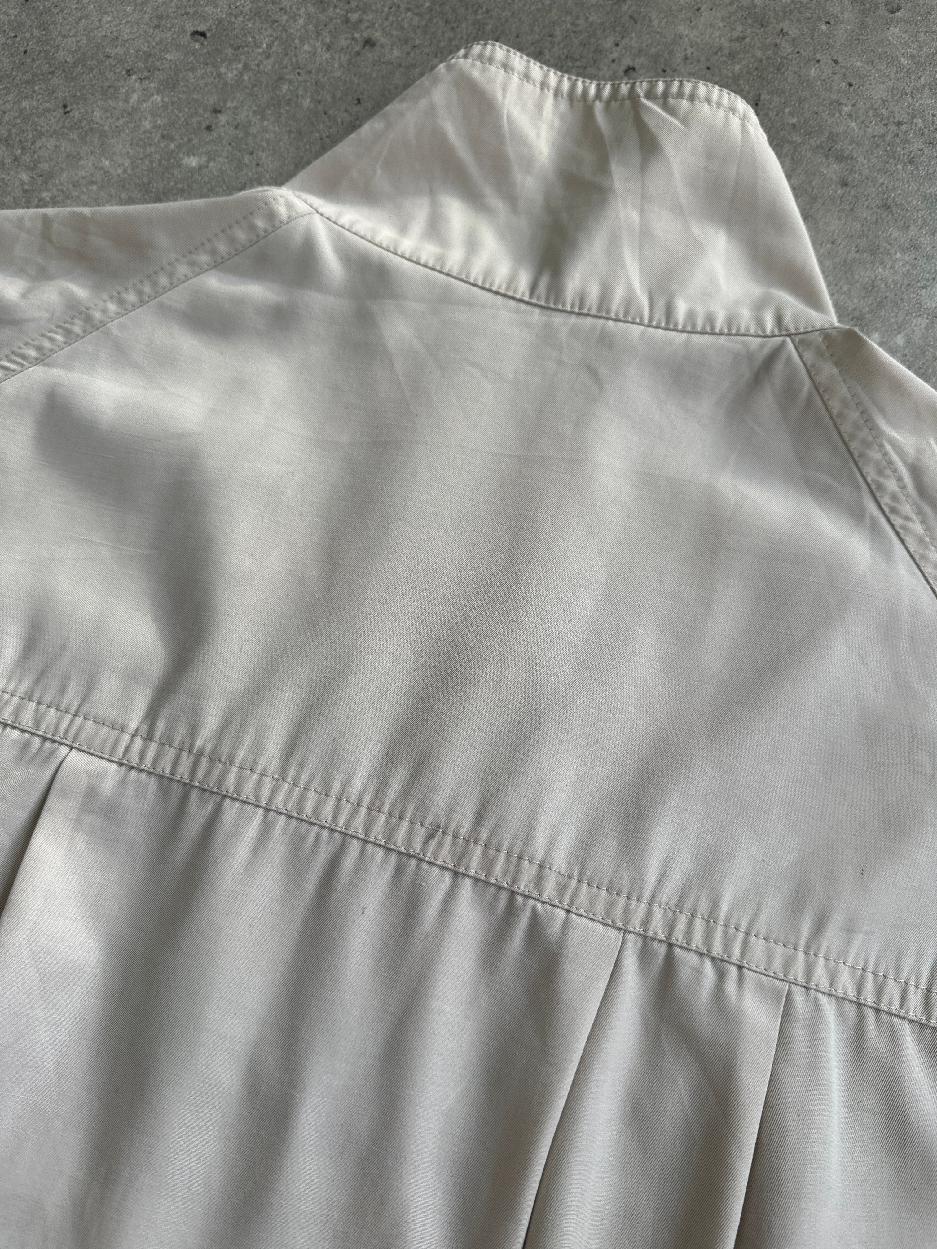 Burberry Nova Check logo bomber jacket in black and beige with ribbed cuffs and collar, size large, front zipper closure.