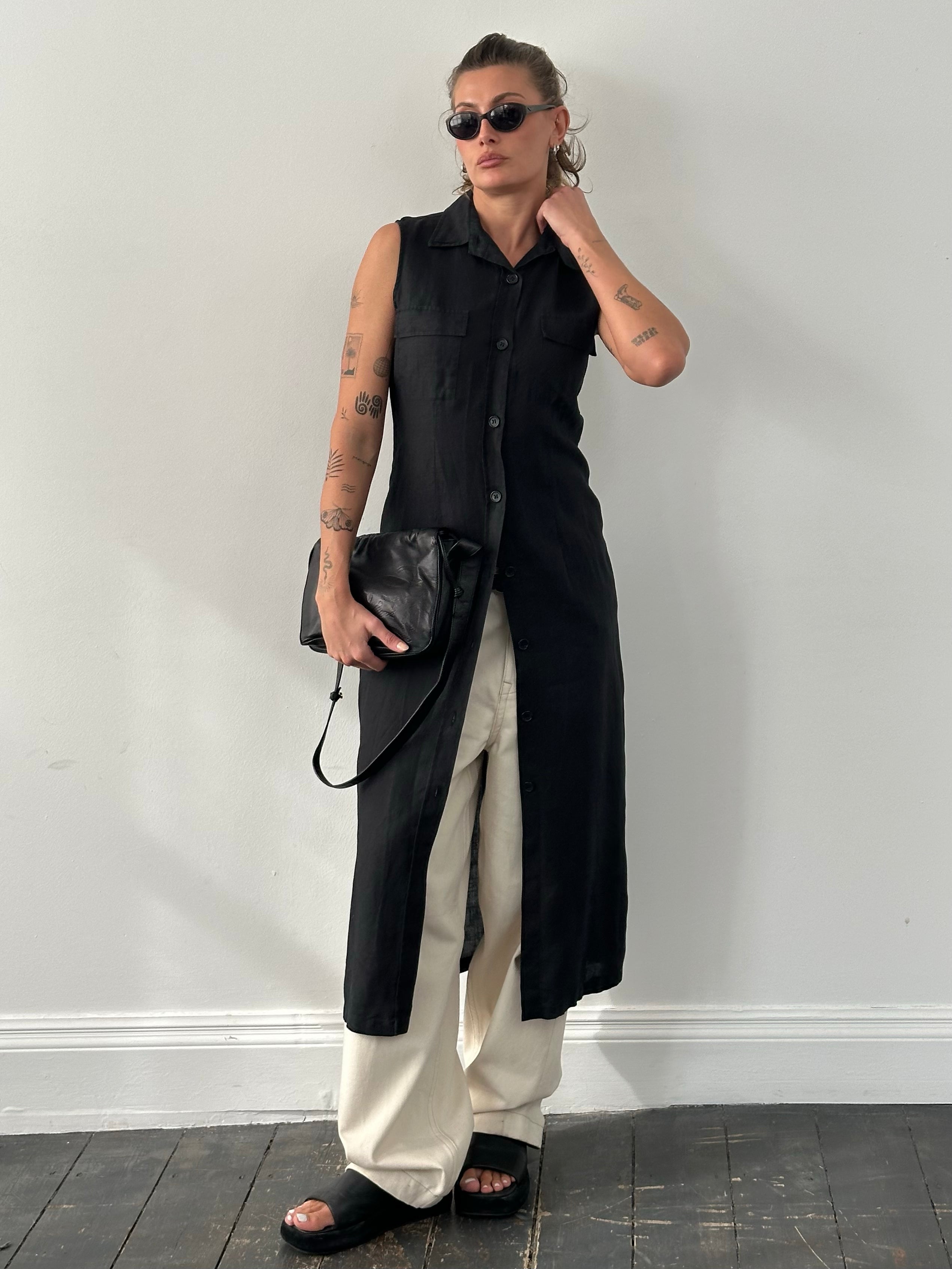 Mani 1990s pure linen sleeveless floor-length dress in natural beige, displaying a flowing, elegant design with a fitted waist.