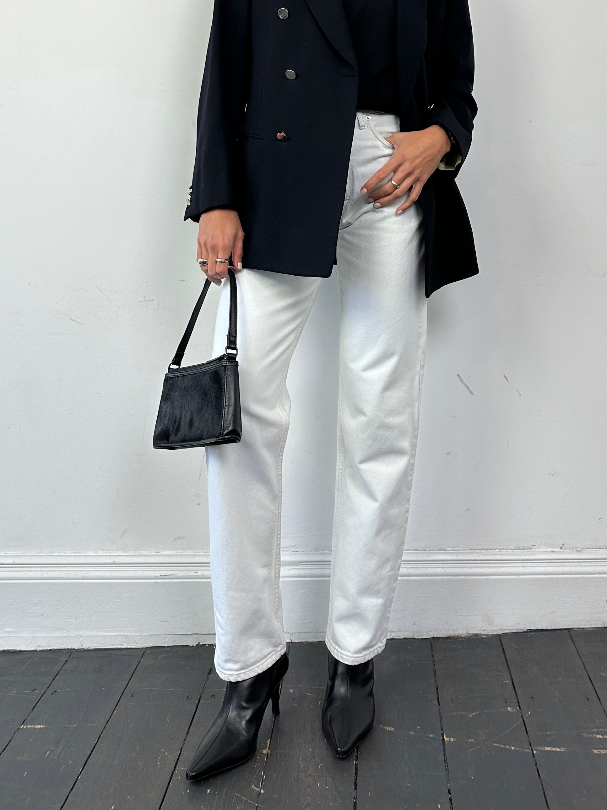 Vintage denim straight leg jeans in size W26, showing classic blue wash and fitted waistband.