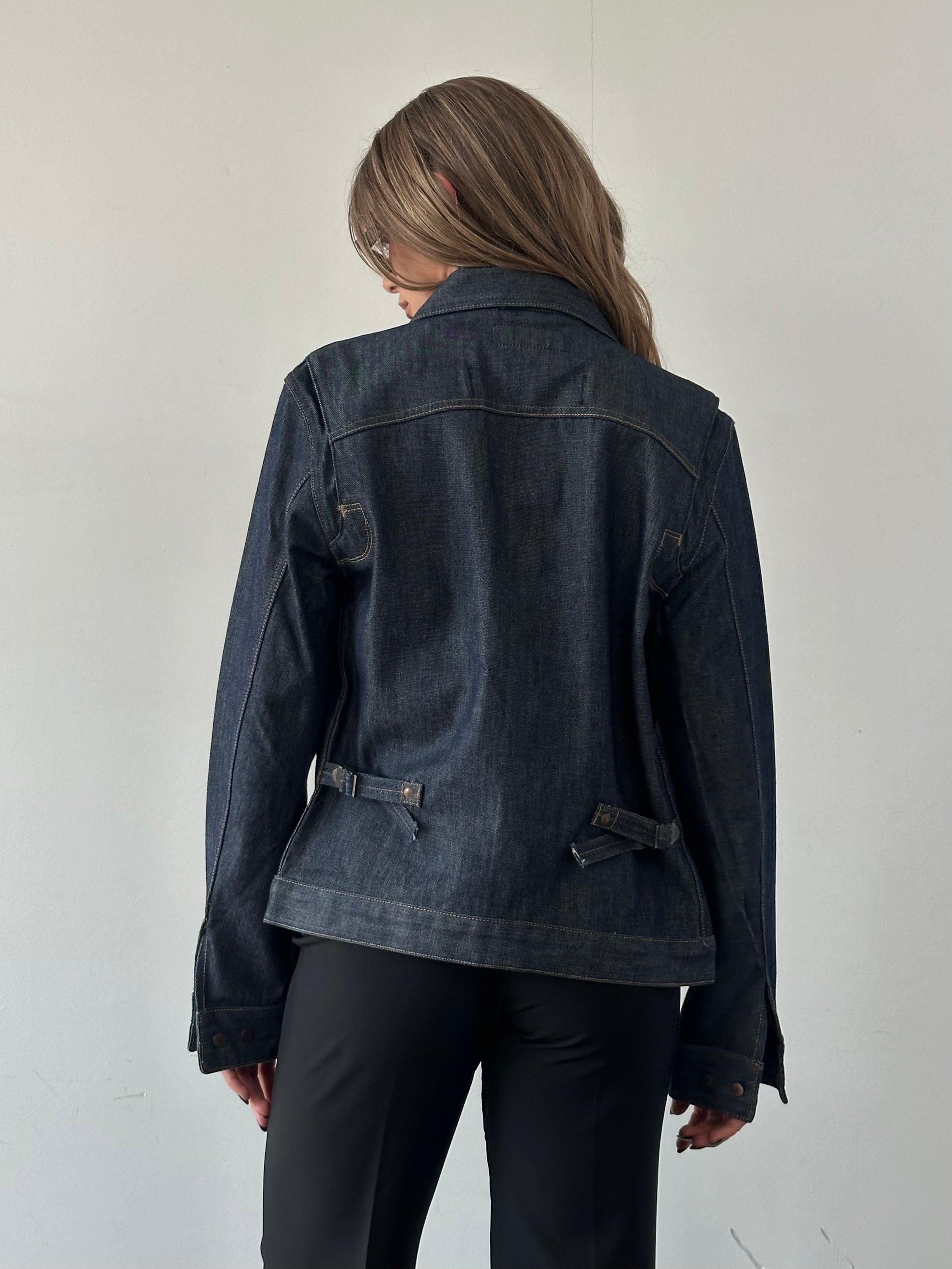 Wrangler organic cotton denim jacket in size S/M, showcasing classic blue denim with button closure and chest pockets.