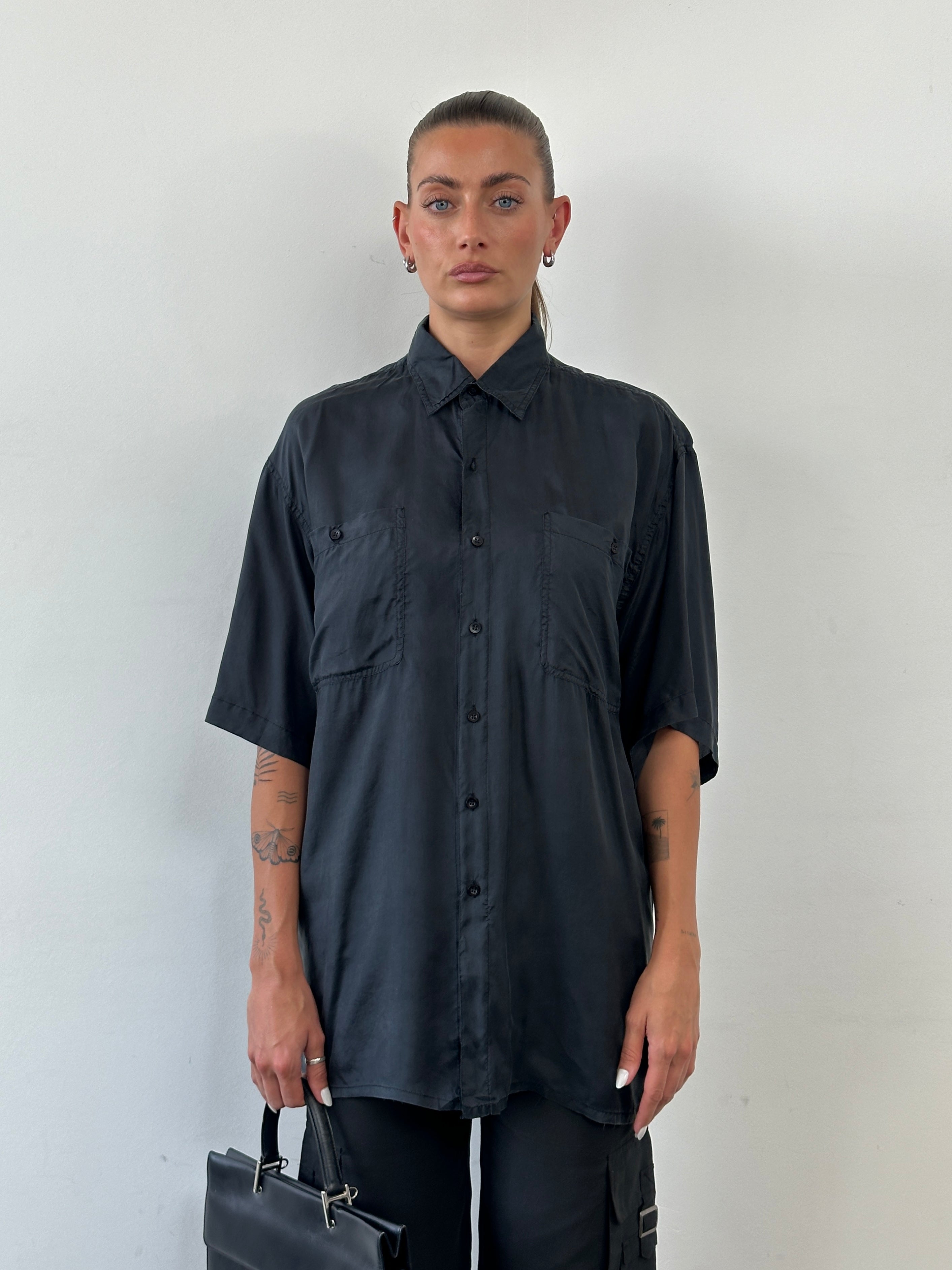 Vintage pure silk short sleeve shirt in size L/XL, featuring a smooth, luxurious fabric and classic design.