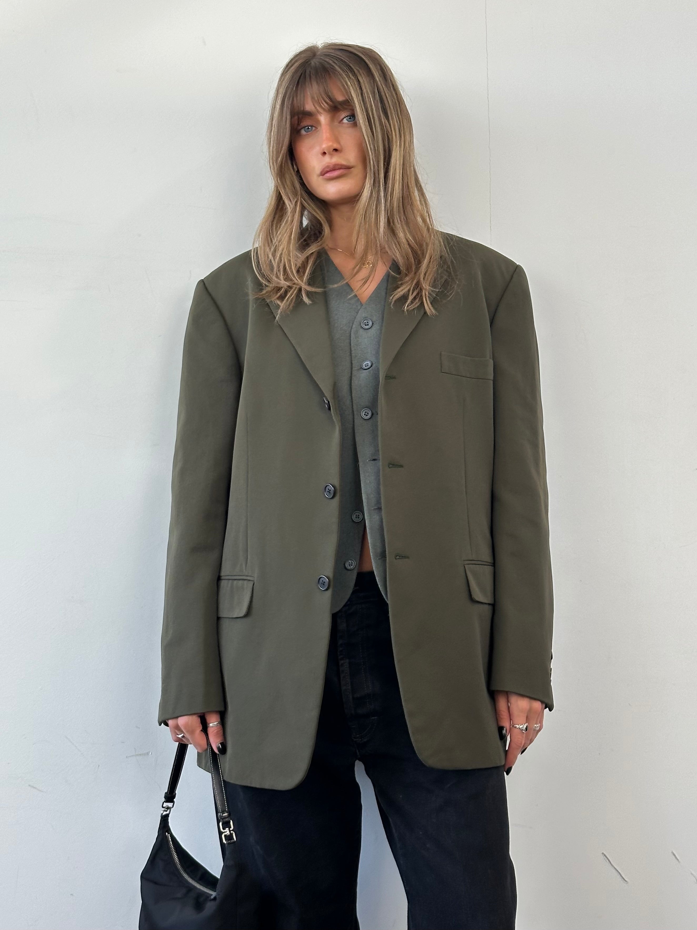 Prada nylon single-breasted blazer in size 44R/XL, shown on a hanger with a sleek, modern design and minimalist style.