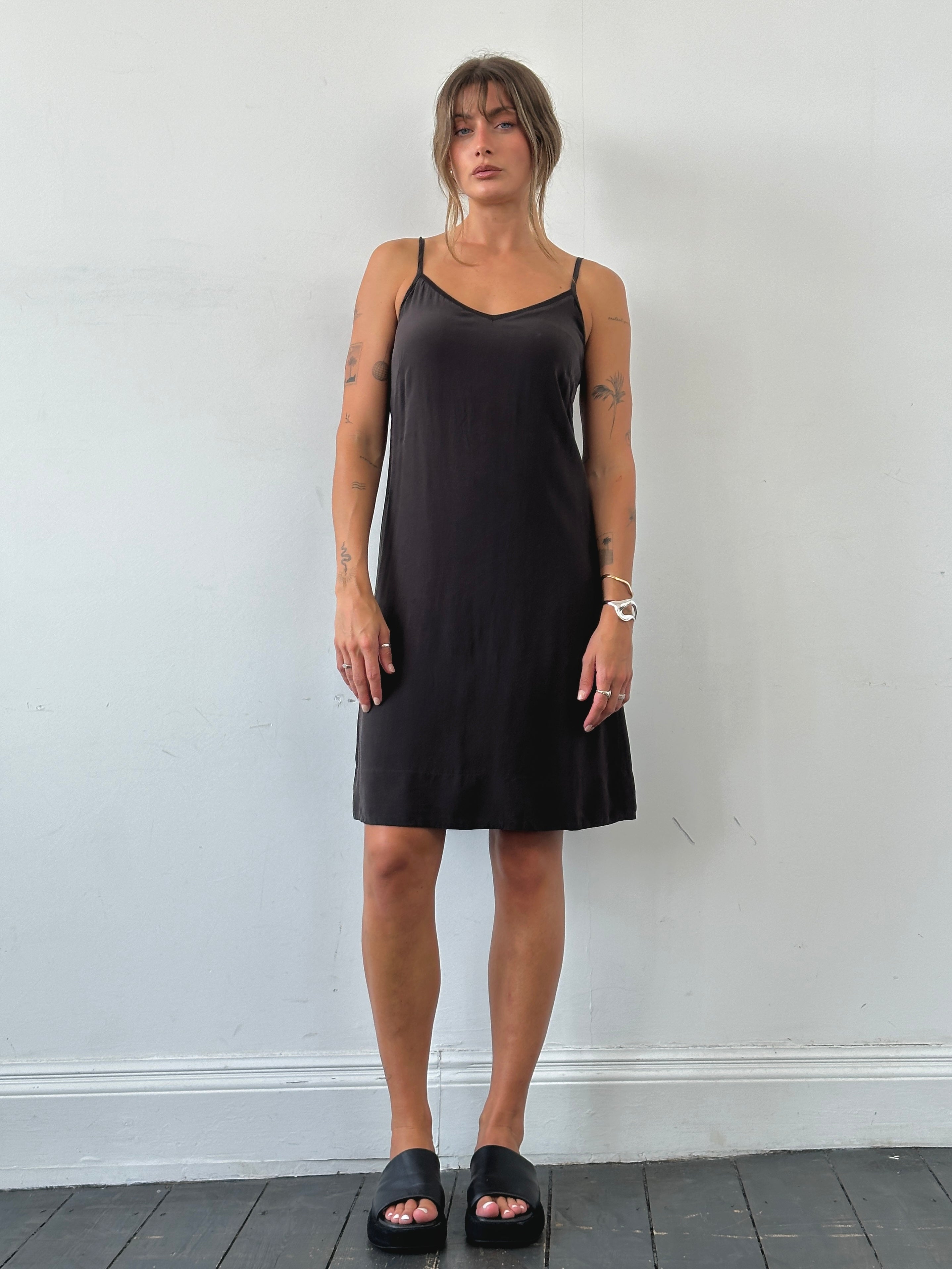Max Mara S pure silk slip dress shown in beige with thin shoulder straps and elegant drape, perfect for sophisticated evening wear.