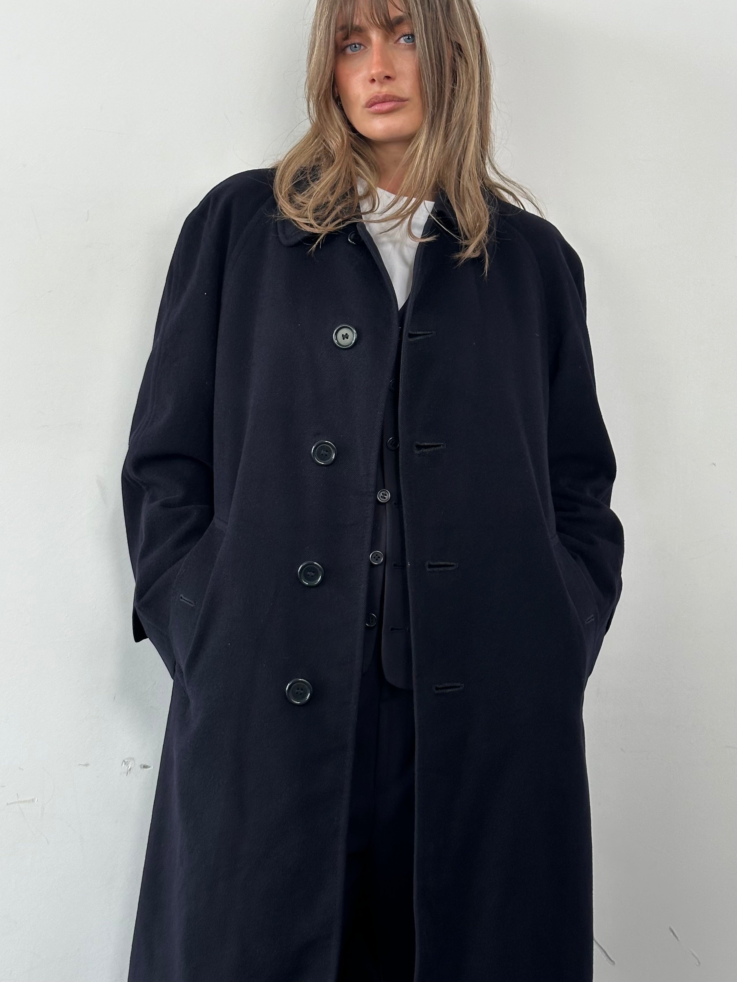 Burberry Pure Cashmere single-breasted coat in size L displayed on a hanger, showcasing classic design and beige color.