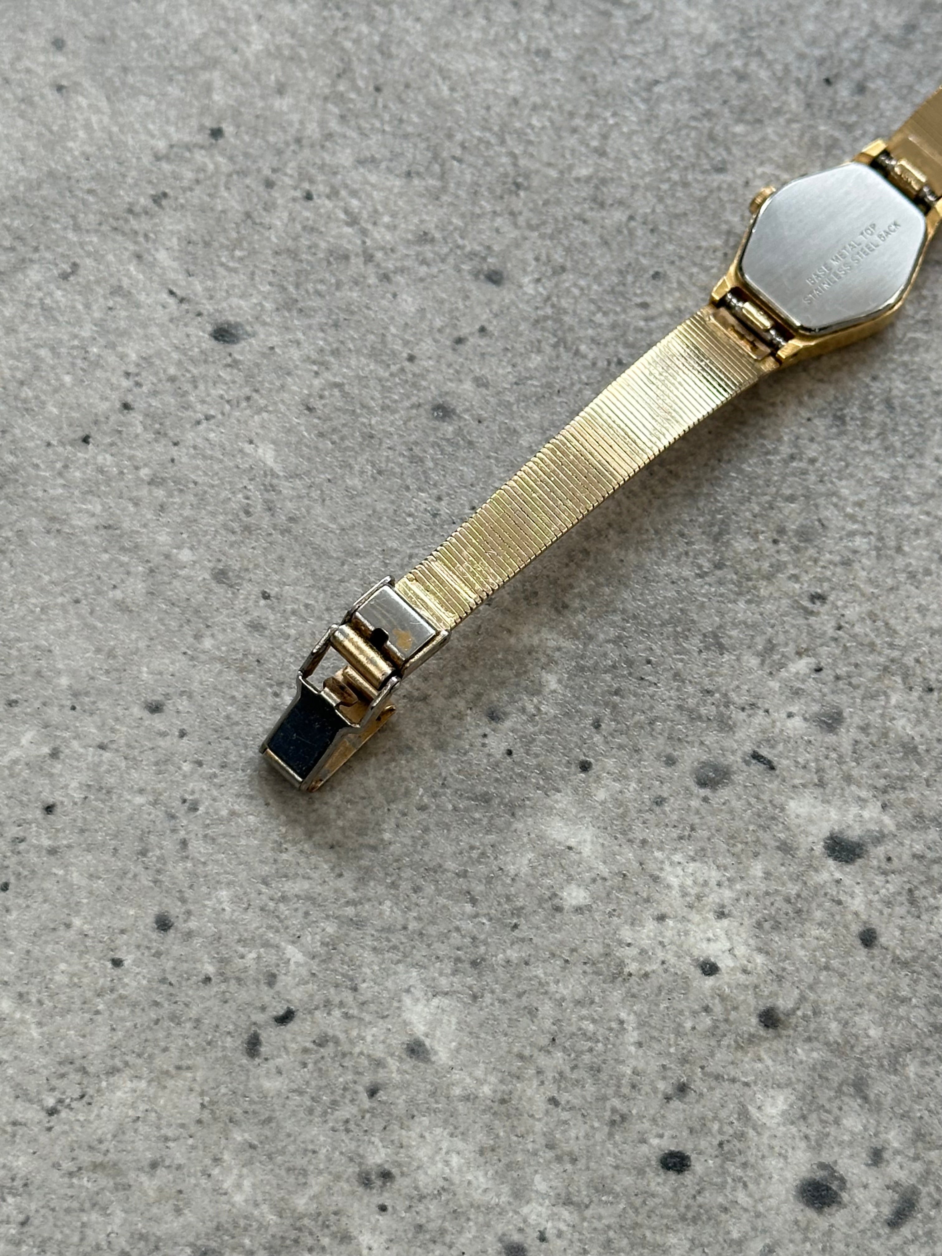 Accurist 1990s gold-tone octagonal quartz watch with a sleek design and classic face, showcasing vintage-inspired style.