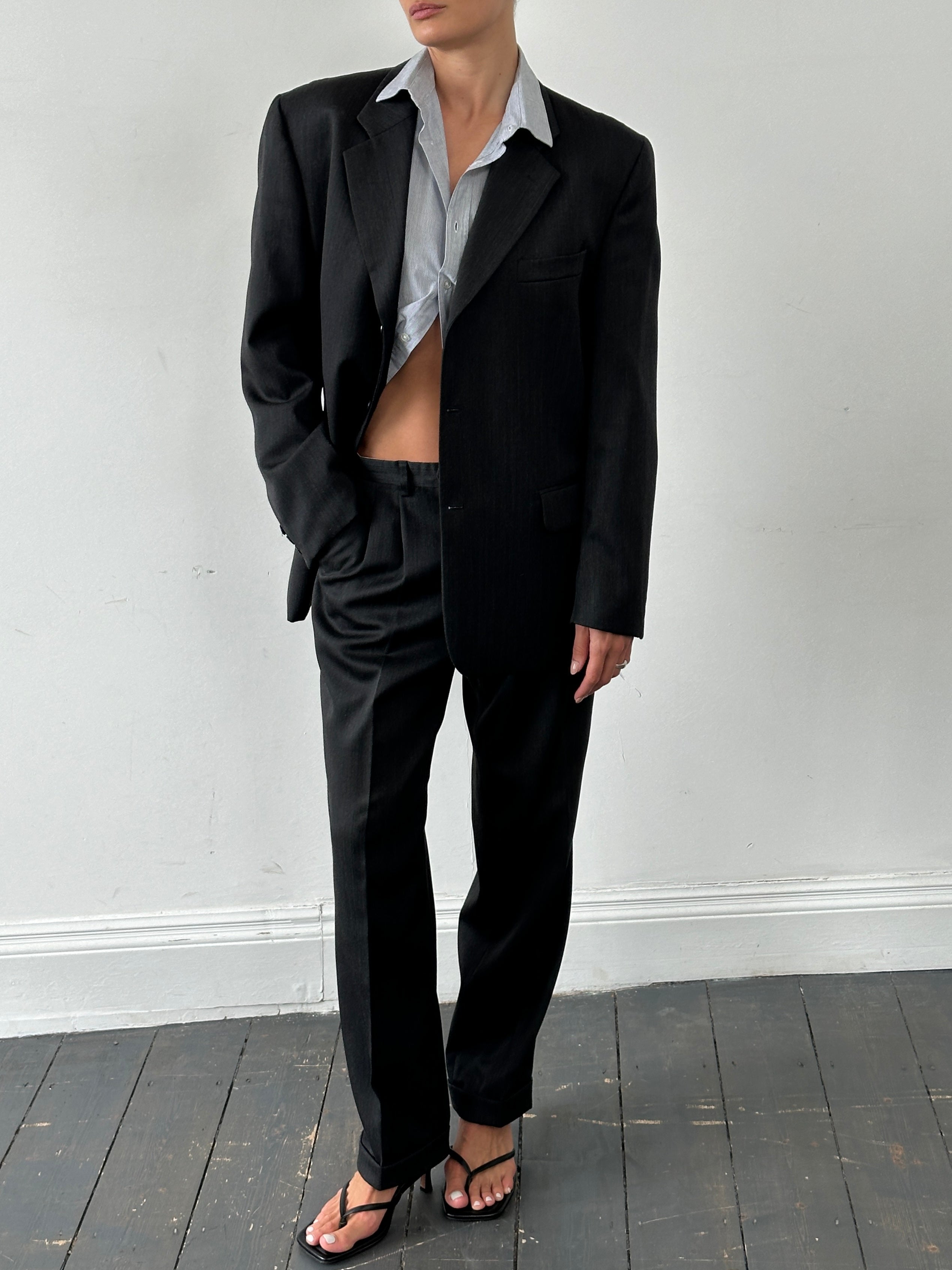 Vintage wool pinstripe single-breasted suit jumpsuit in size 40R/W32, featuring classic tailored design and pinstripe fabric.