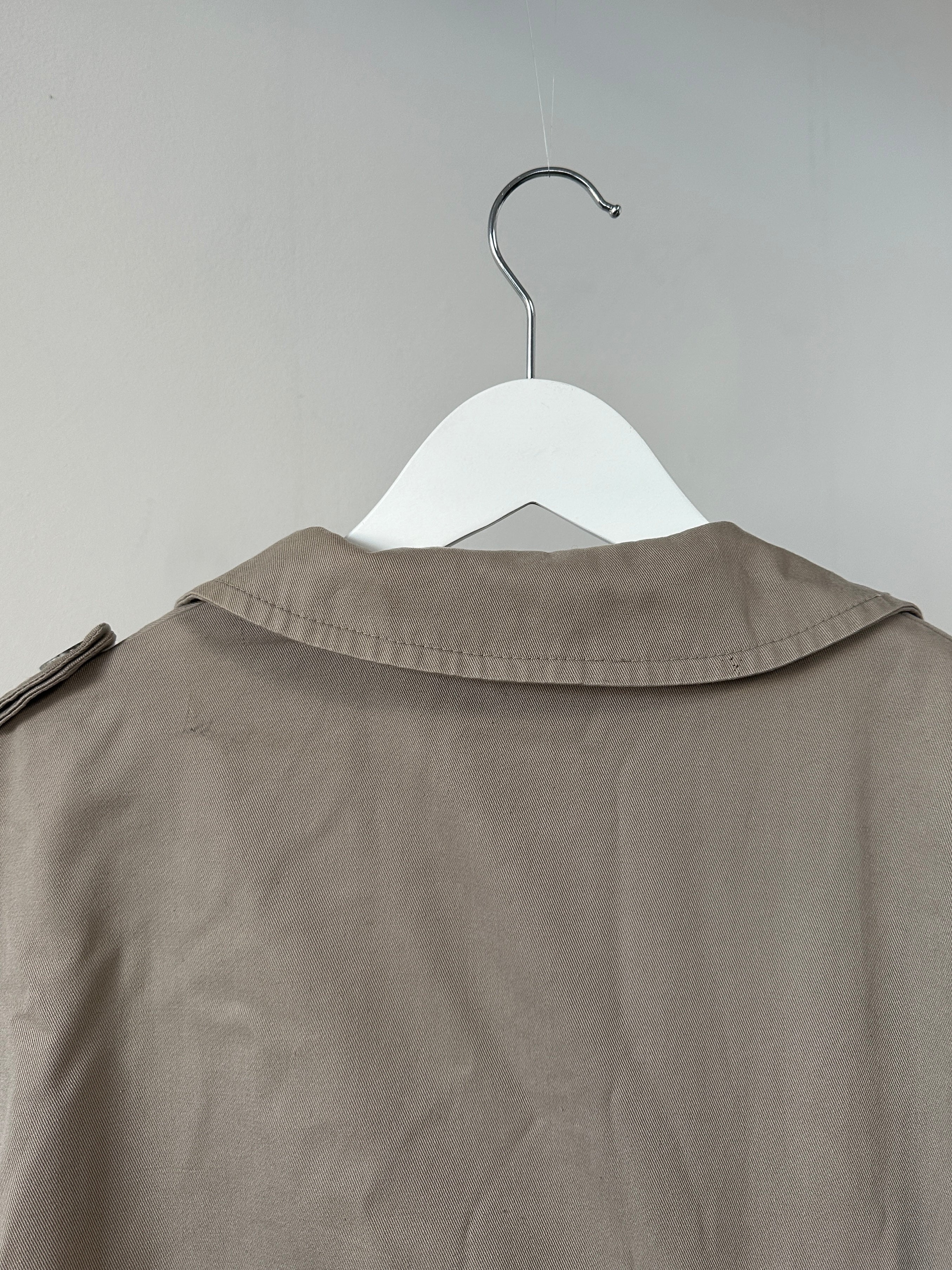 Christian Dior double-breasted cotton trench coat in size L/XL, featuring classic design and tailored fit.
