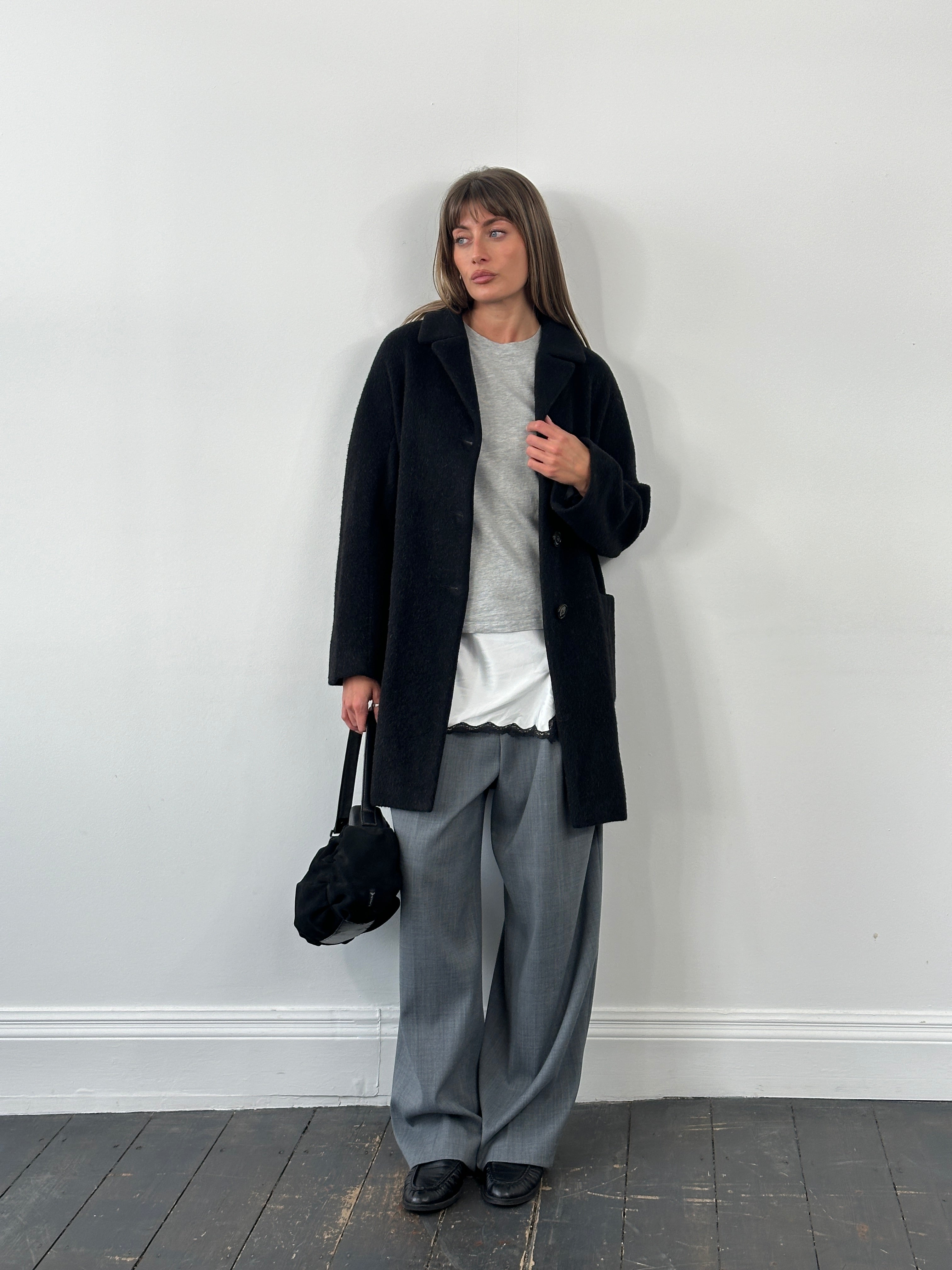 Max Mara Weekend 1990s wool and mohair single-breasted coat in black, displayed on a hanger with a tailored fit.