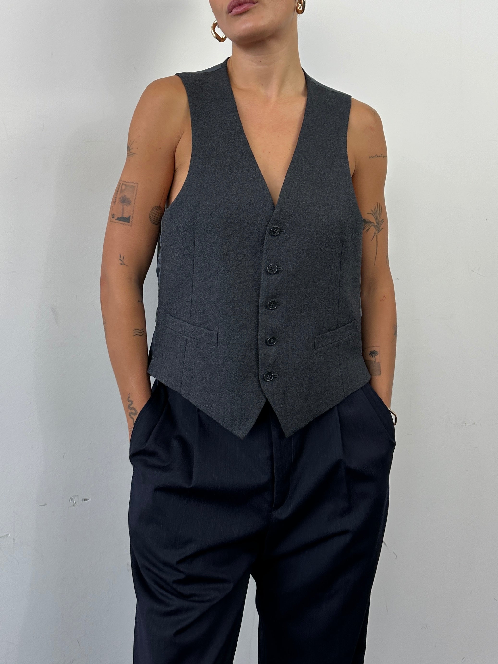 Vintage pure wool single-breasted tailored waistcoat in size L, featuring classic design and quality craftsmanship.