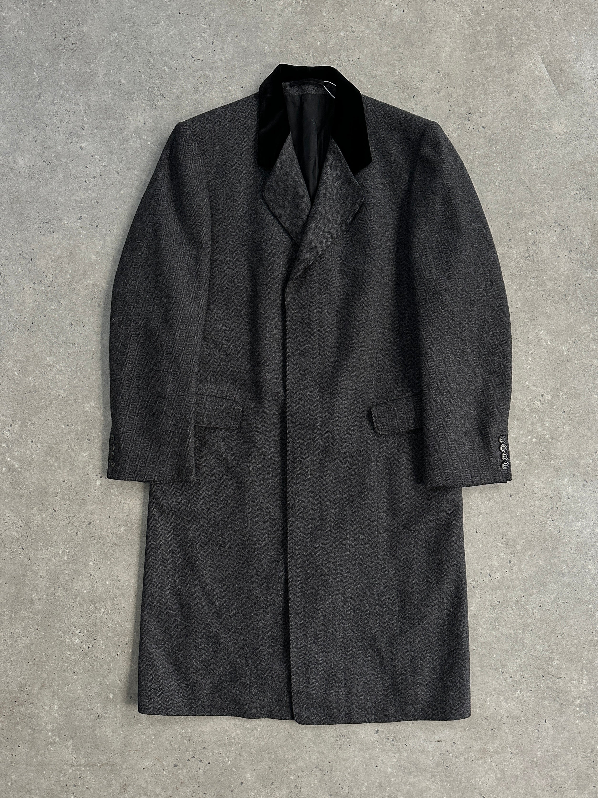 Christian Dior pure wool single-breasted coat in size L/XL, shown on a hanger with a classic tailored design and neutral color.