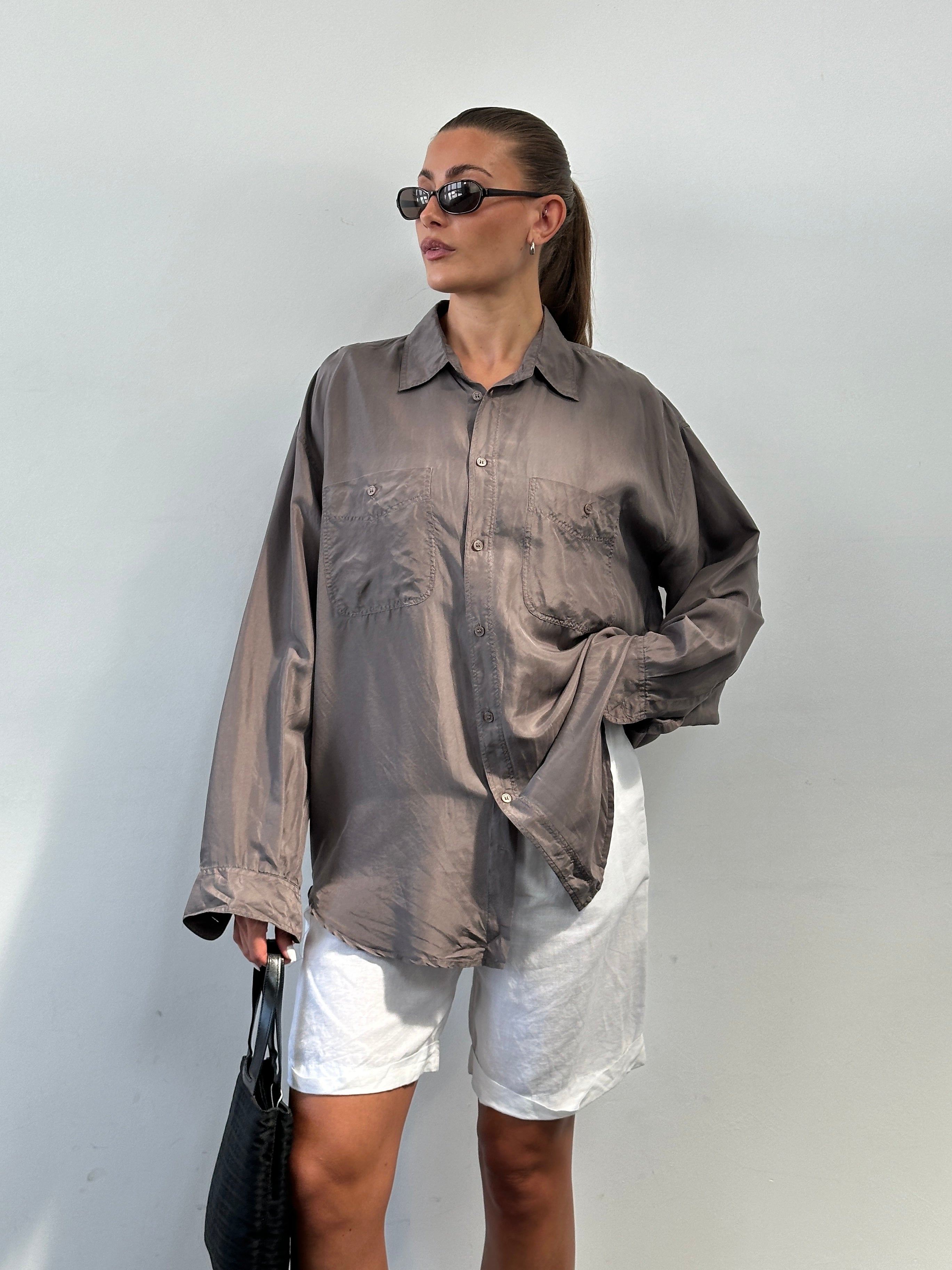 Vintage pure silk shirt in XL size displayed, featuring a classic design and smooth fabric texture.