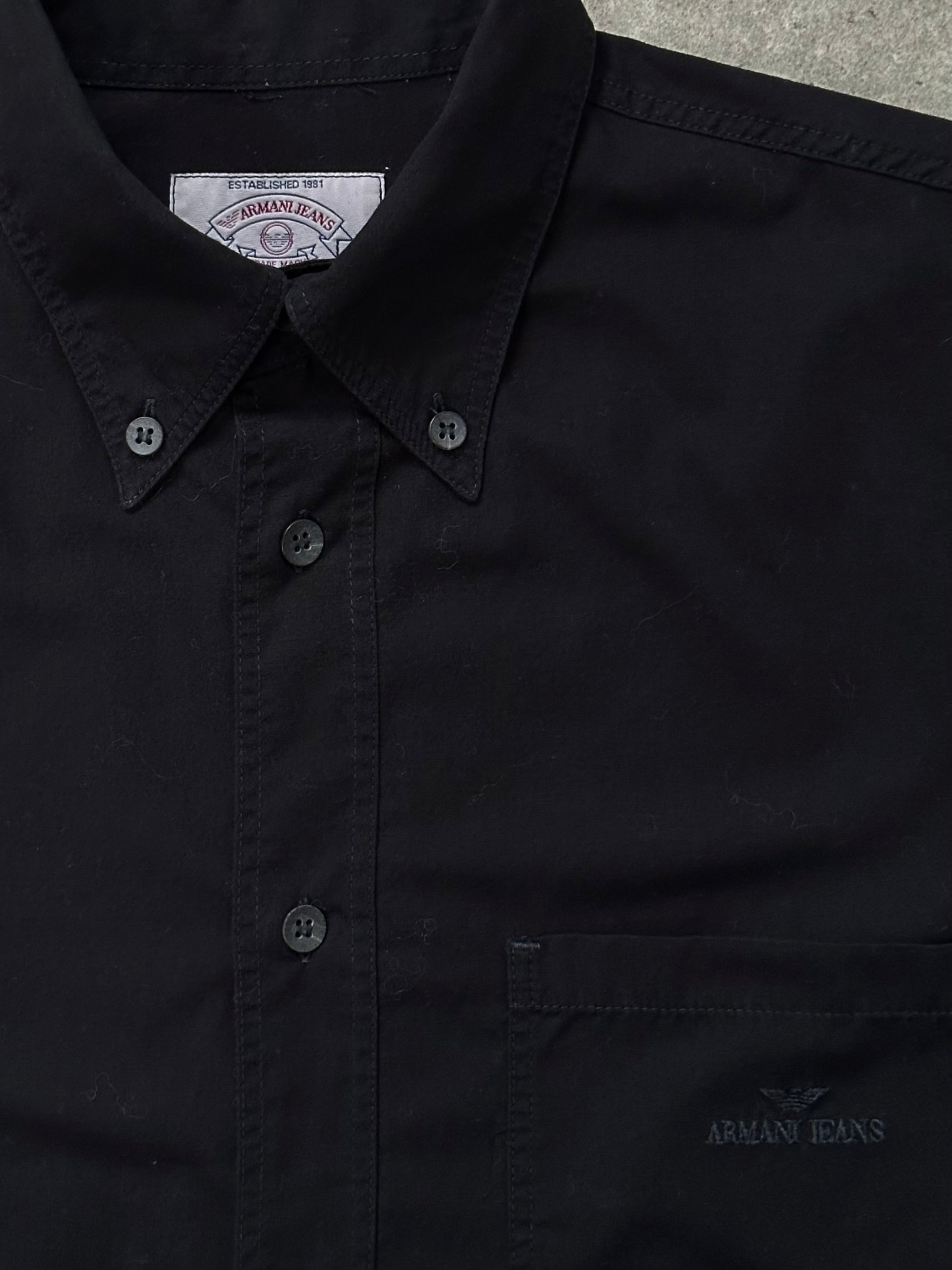 Armani Jeans 1990s cotton logo shirt in size L/XL, featuring a classic design with the Armani logo on the front.